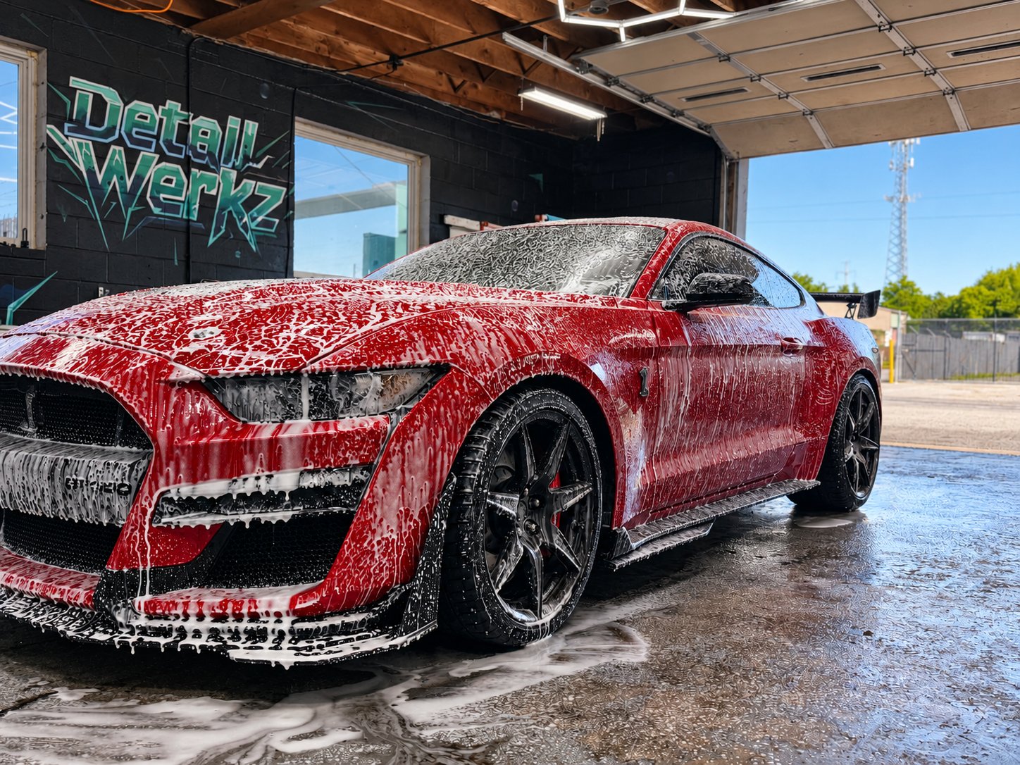 Red Ford Mustang covered in soap at Detail Werkz in Frederick, Maryland