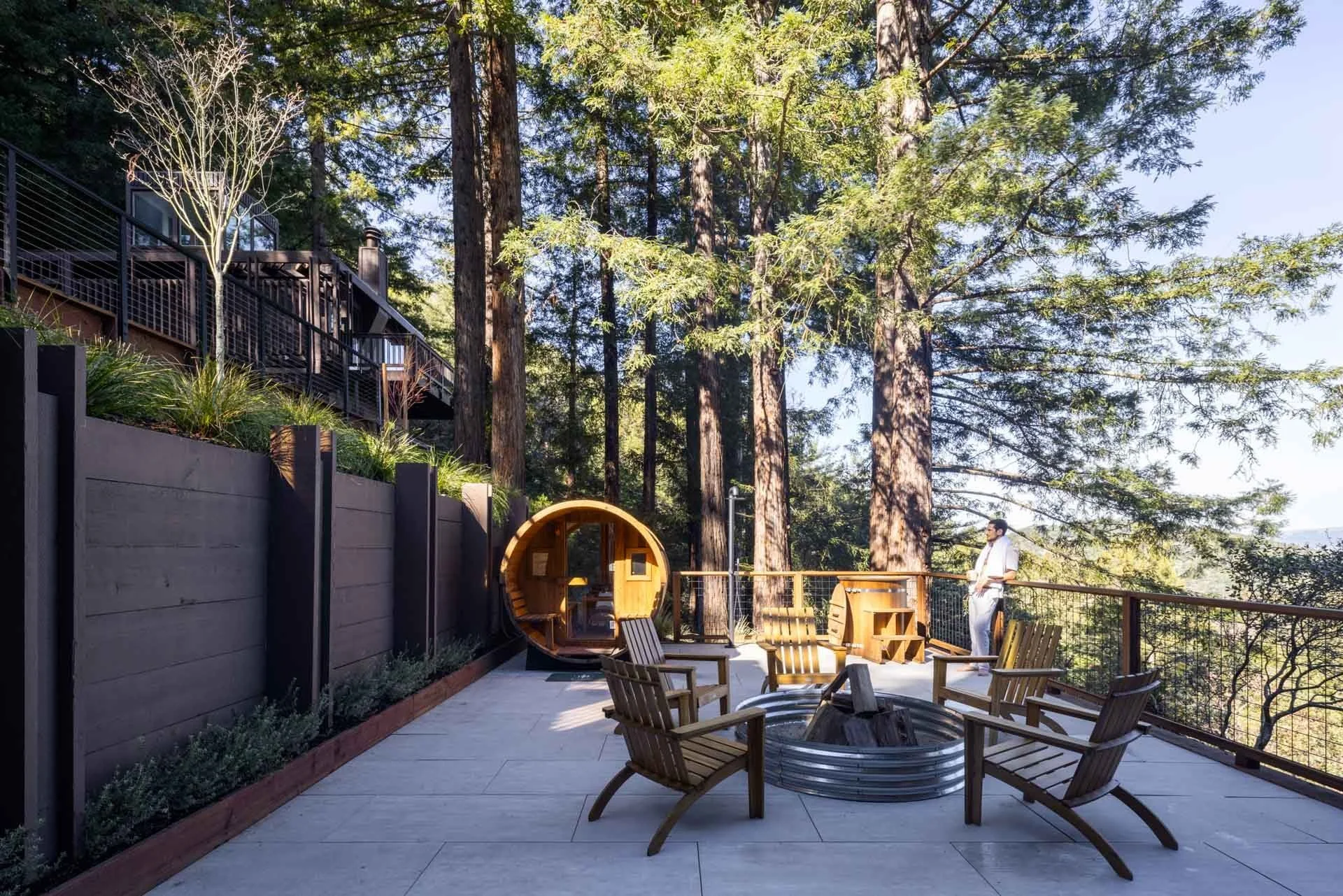 Hillside terrace with a fire pit, barrel sauna and lounge chairs among the redwoods, 238 Summit Drive, Corte Madera