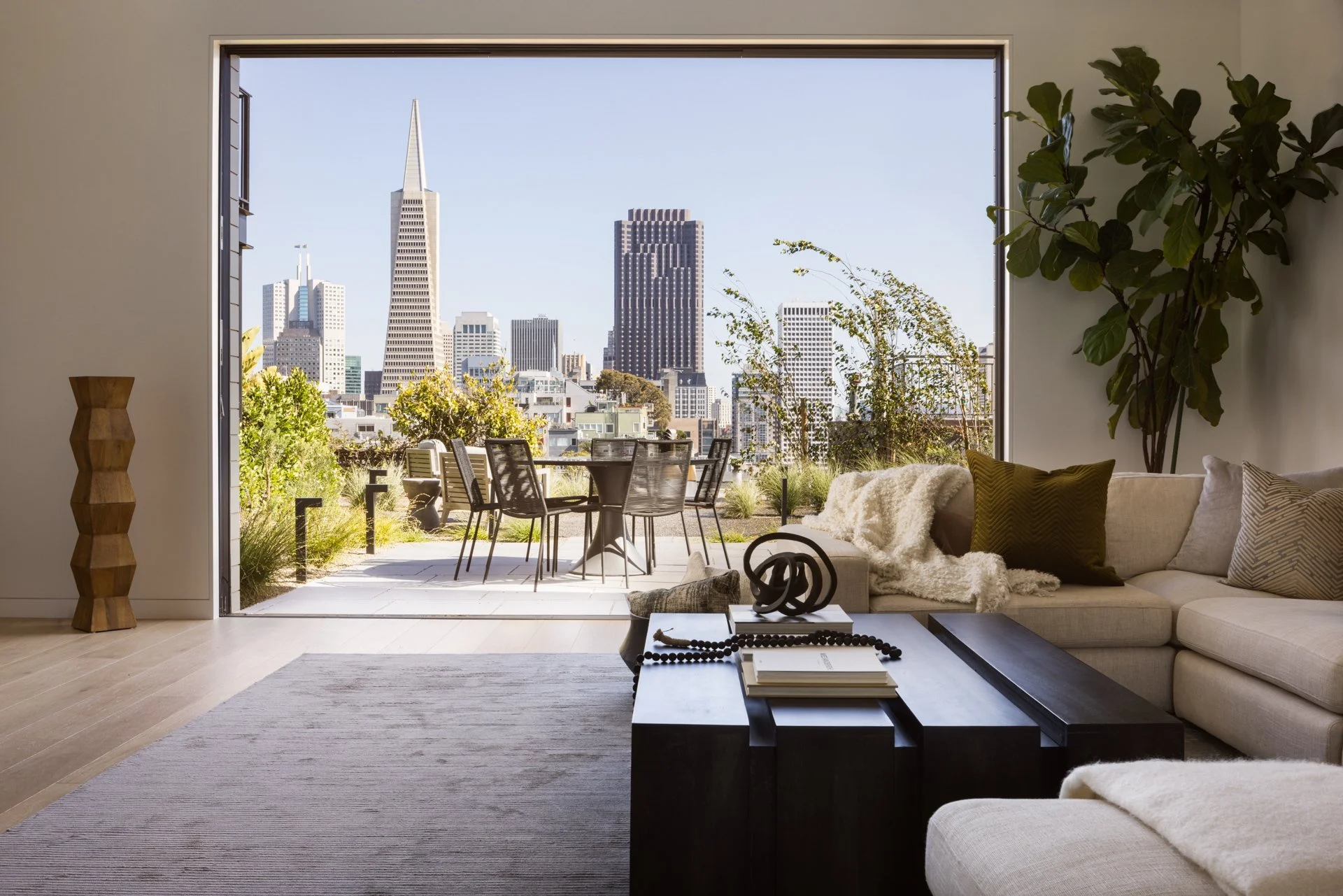 Living room opening onto a terrace framing the Transamerica Pyramid, 119 Telegraph, Telegraph Hill, San Francisco
