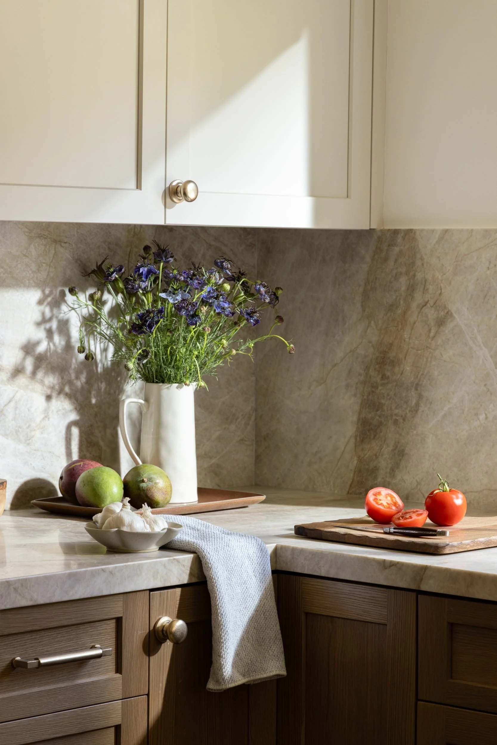 Kitchen corner with wildflowers and fruit on a quartzite counter, 283 Fairway Drive, Barlow Design