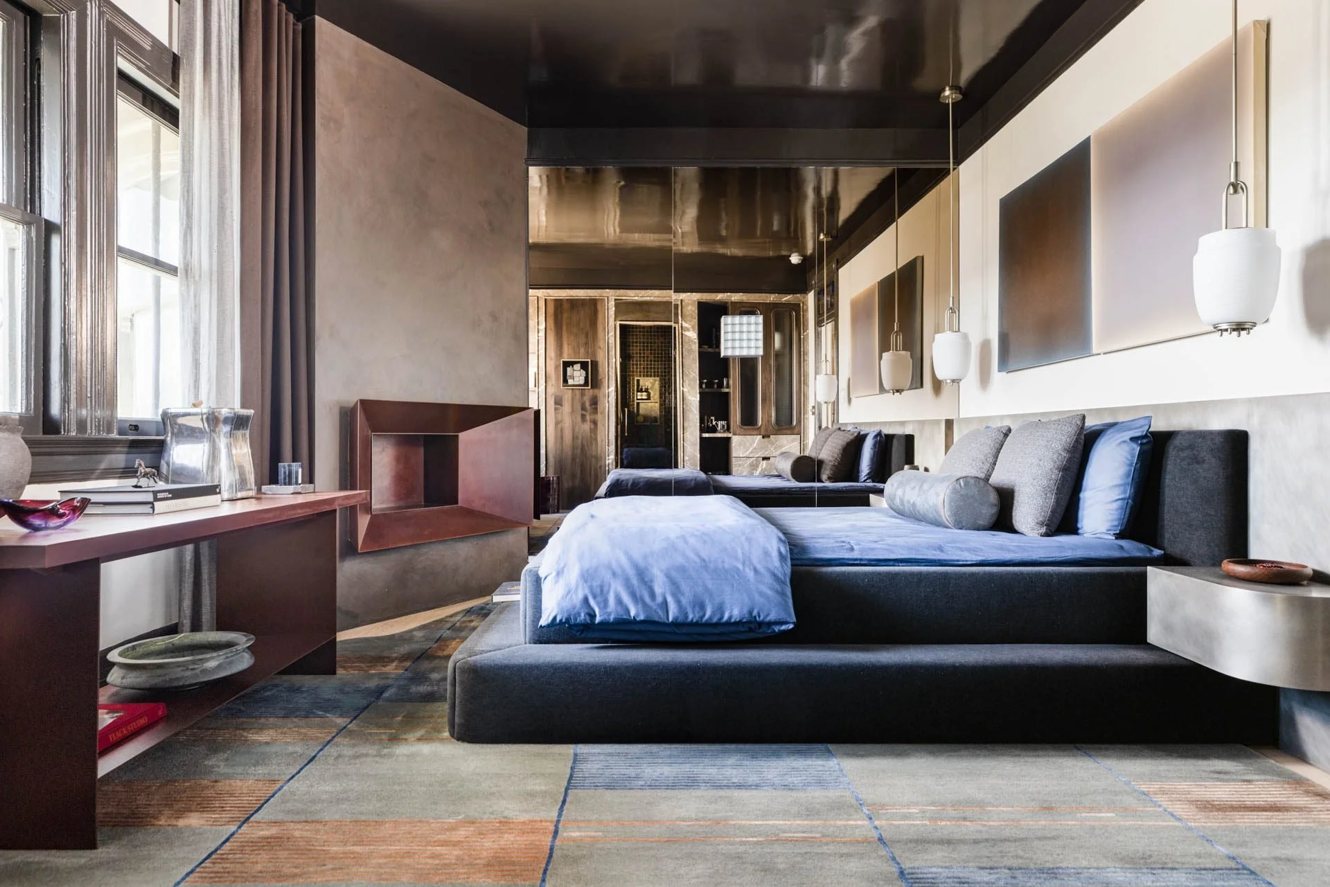 Moody bedroom with a low platform bed, plaster walls and a dark ceiling, 2315 Broadway, San Francisco Decorator Showcase