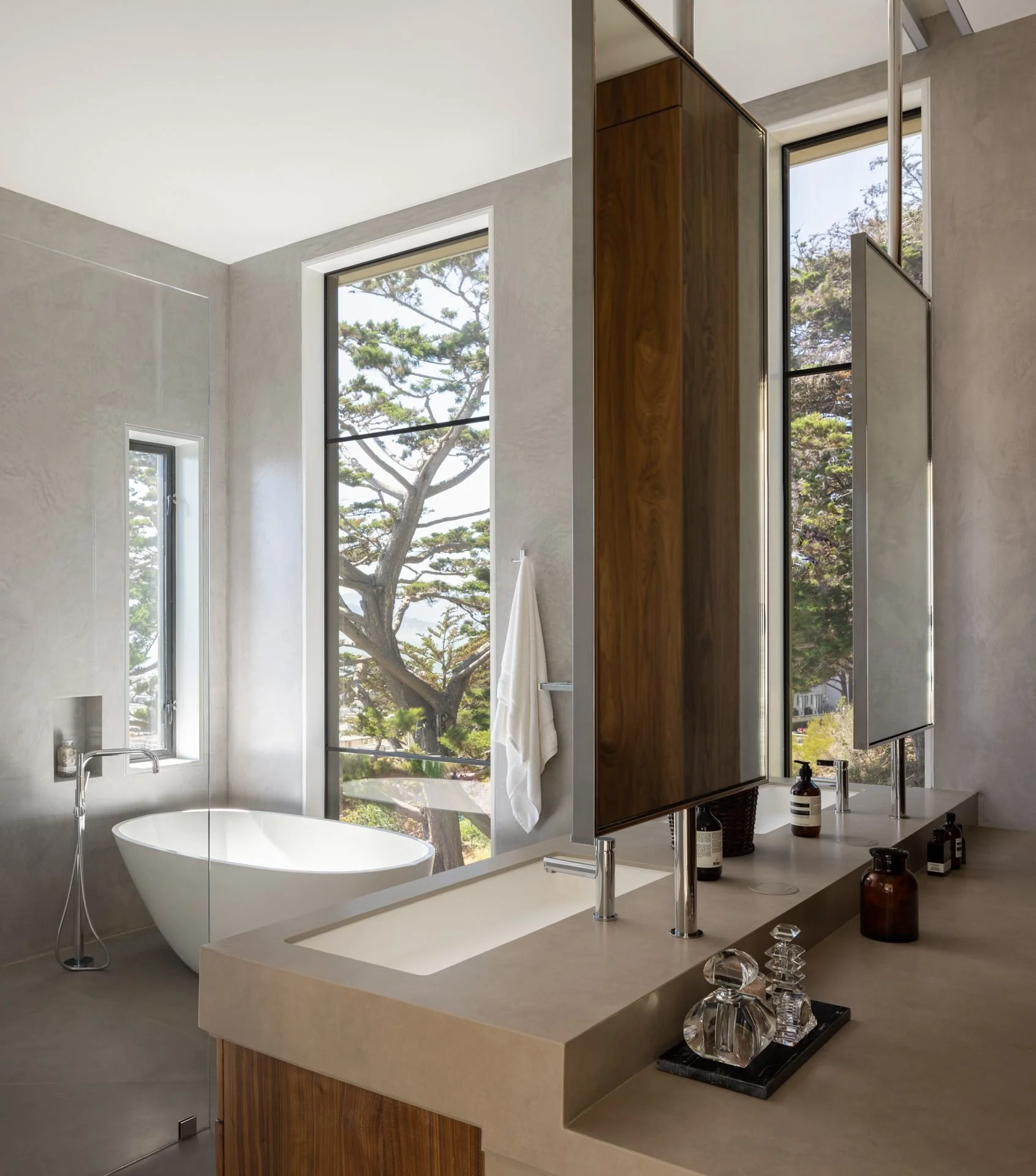 Primary bathroom with a freestanding tub, plaster walls and tree-view windows, 119 Telegraph, San Francisco