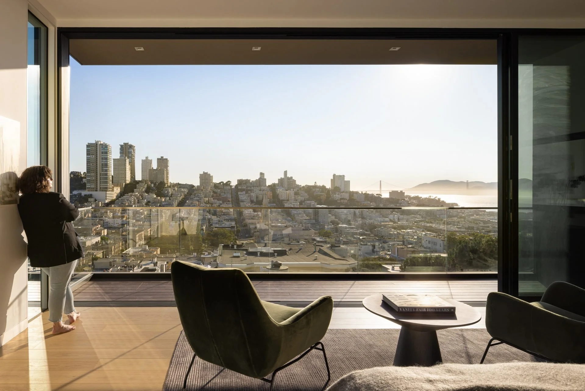 Wall of glass framing the San Francisco Bay and skyline from a sitting room, 119 Telegraph, Telegraph Hill