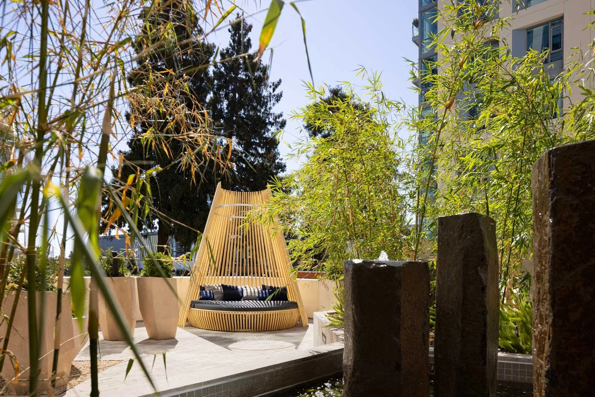 Courtyard garden with a woven pod seat, bamboo and basalt water features, The Martin, Sunnyvale