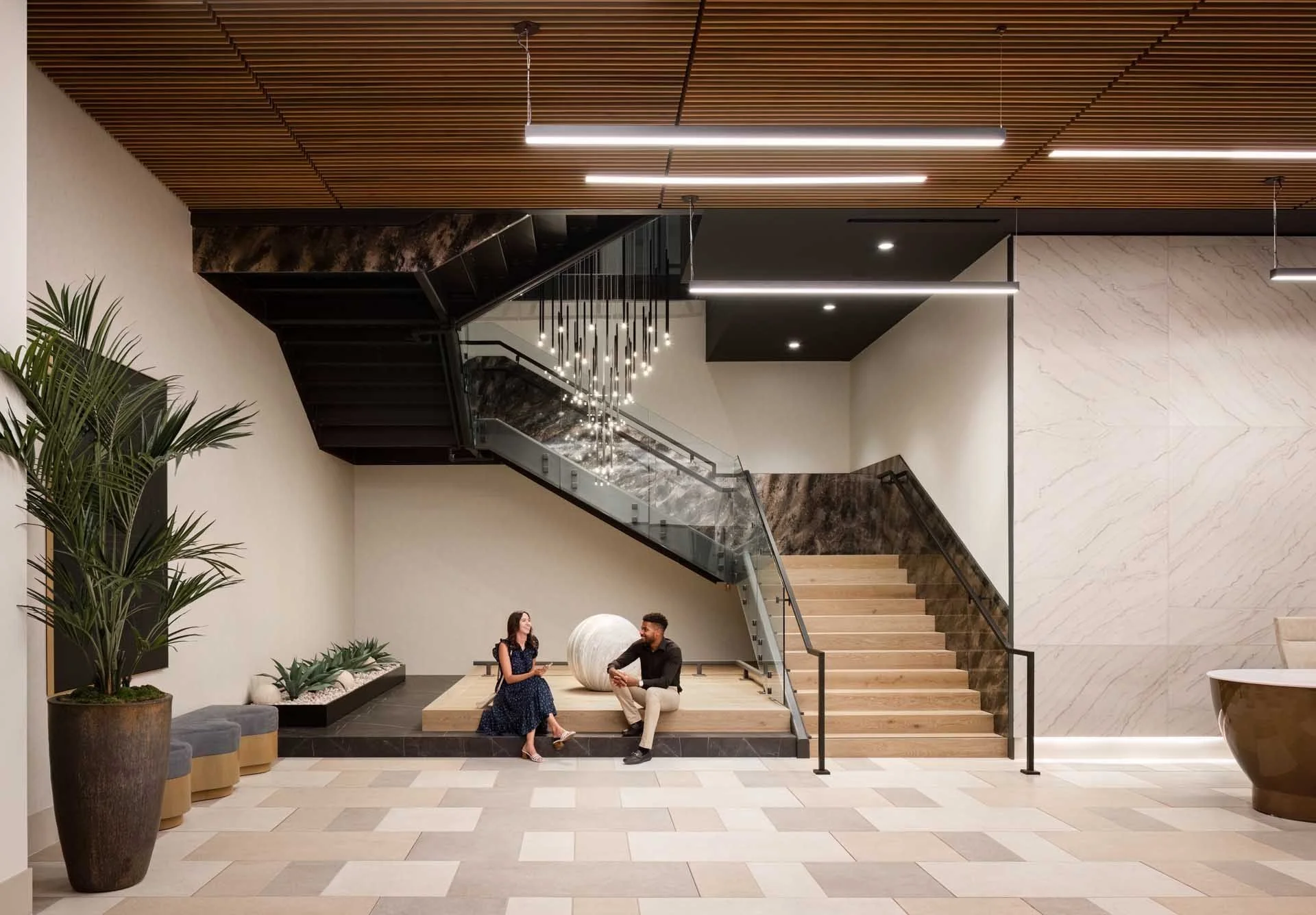 Lobby with a sculptural staircase, wood ceiling and stepped seating, The Martin at CityLine, Sunnyvale