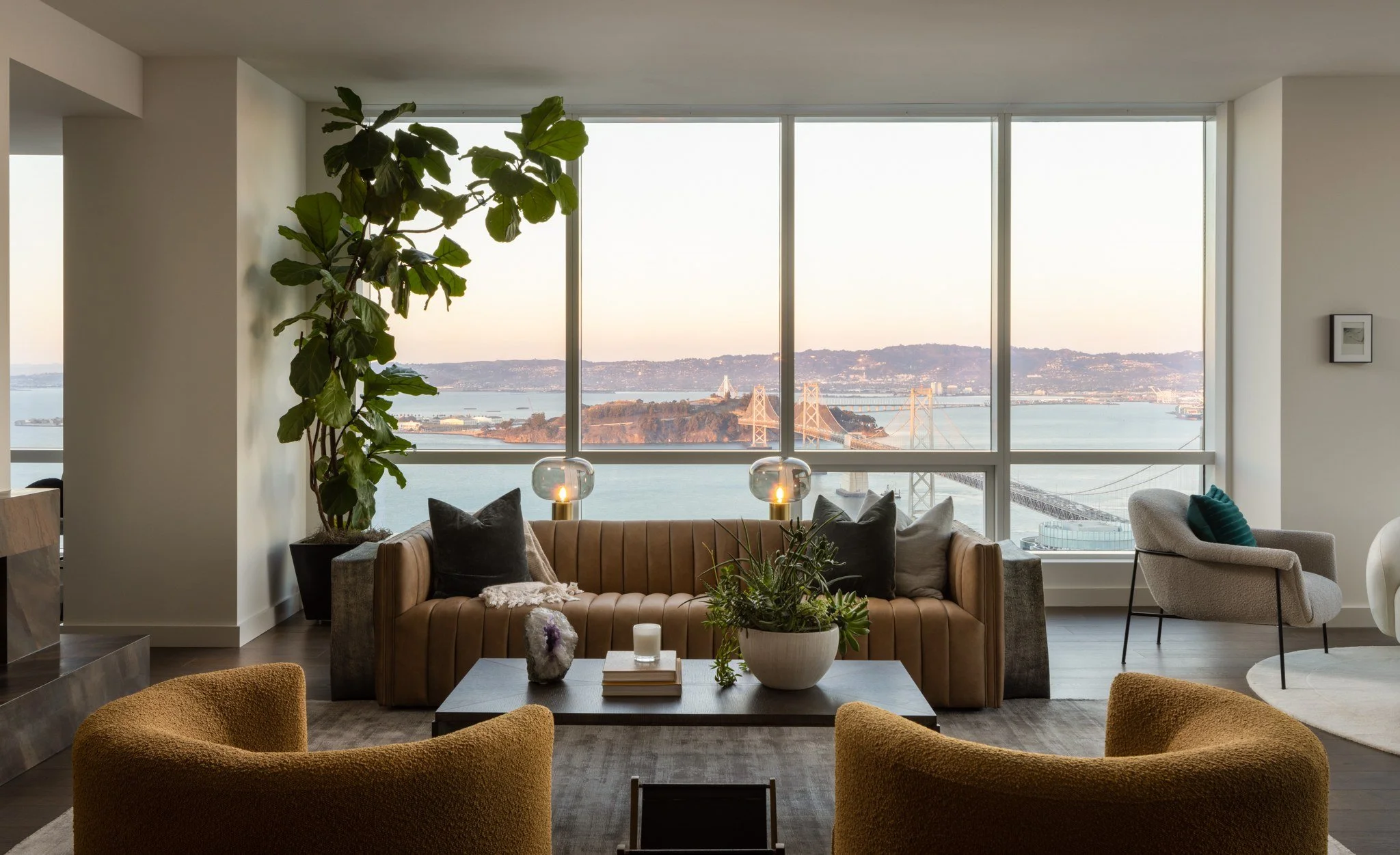 Penthouse living room with walls of glass onto the Bay, The Avery, San Francisco