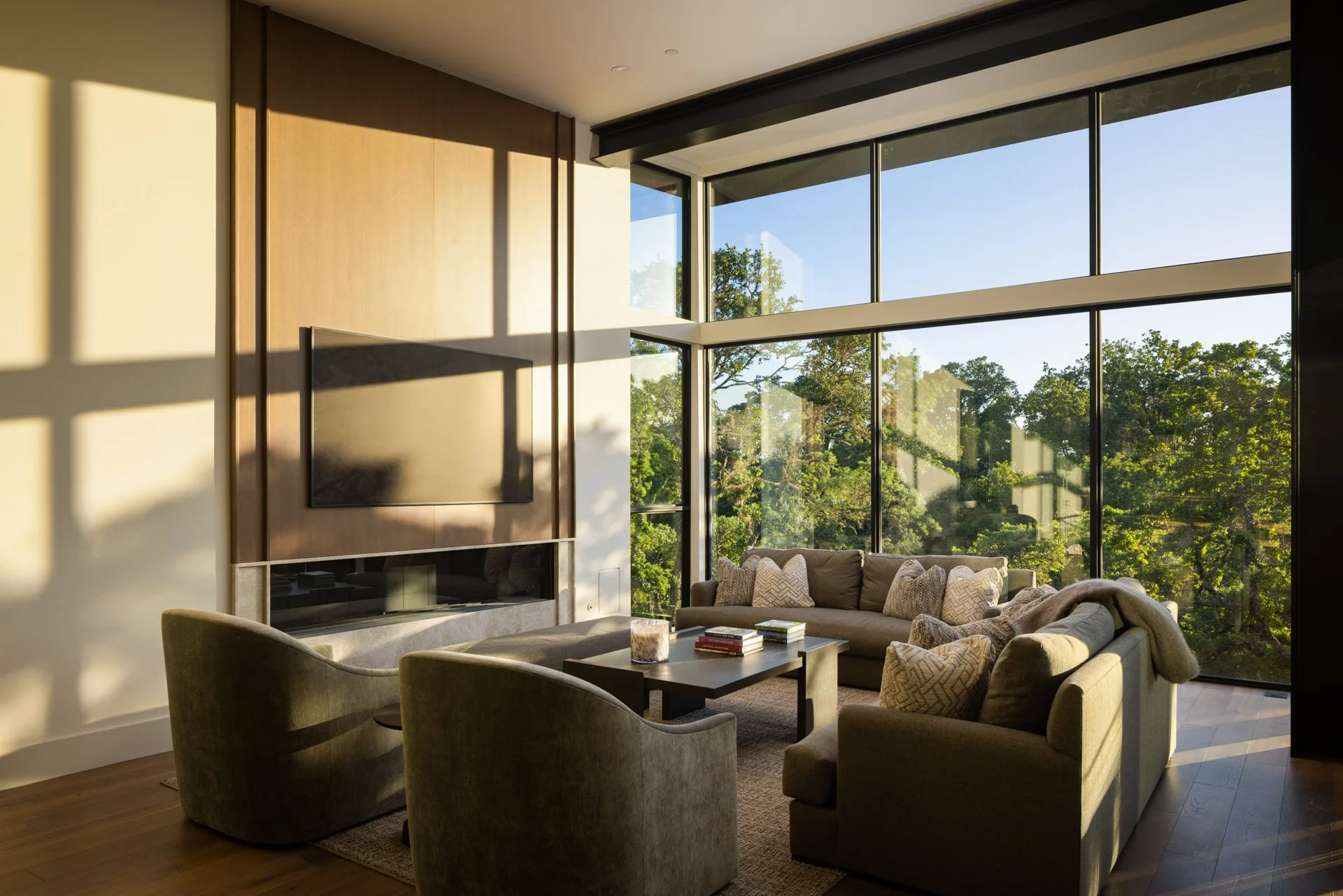 Living room in late-afternoon light through floor-to-ceiling windows, a resort residence at Montage Healdsburg