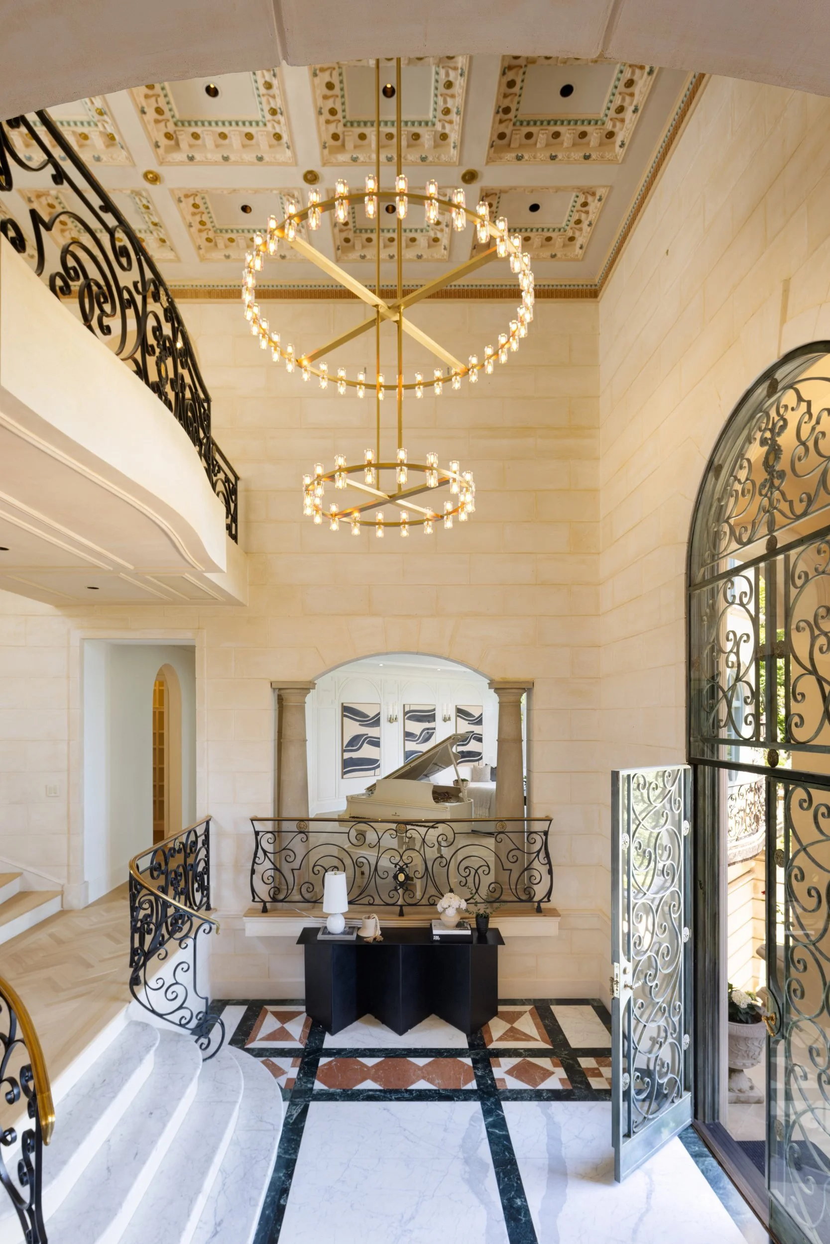Grand foyer with chandelier and arched windows, 27 Upper Road, Ross