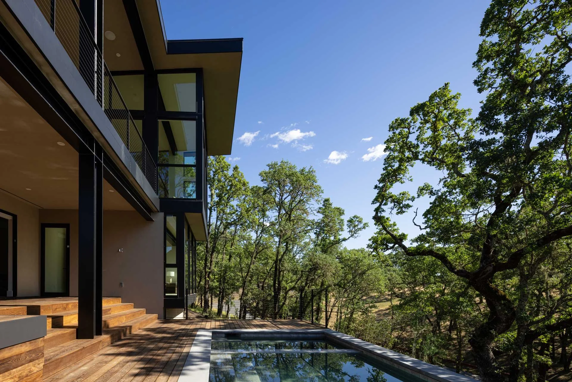 Pool terrace beneath the oak canopy, a resort residence at Montage Healdsburg