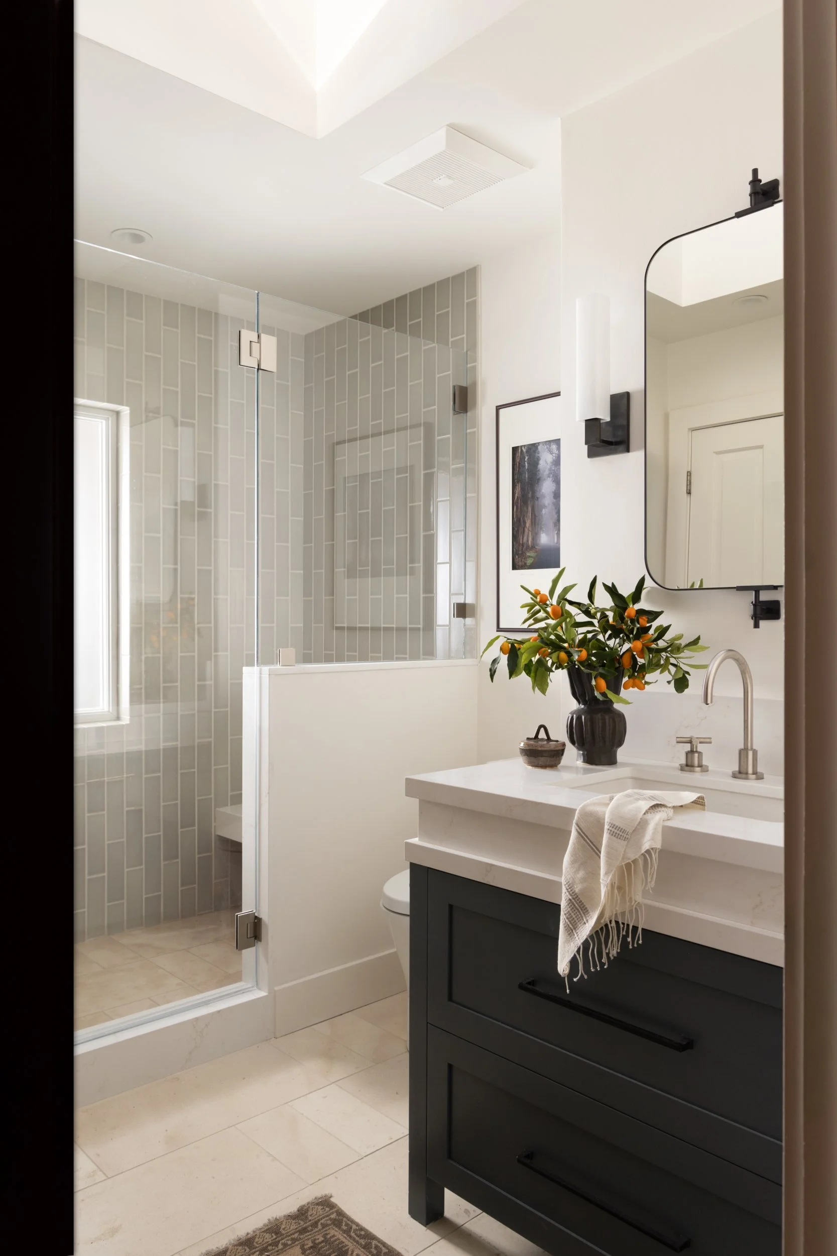 Bathroom with glass shower, green vanity and round mirror, 286 Almenar Drive, Marin County