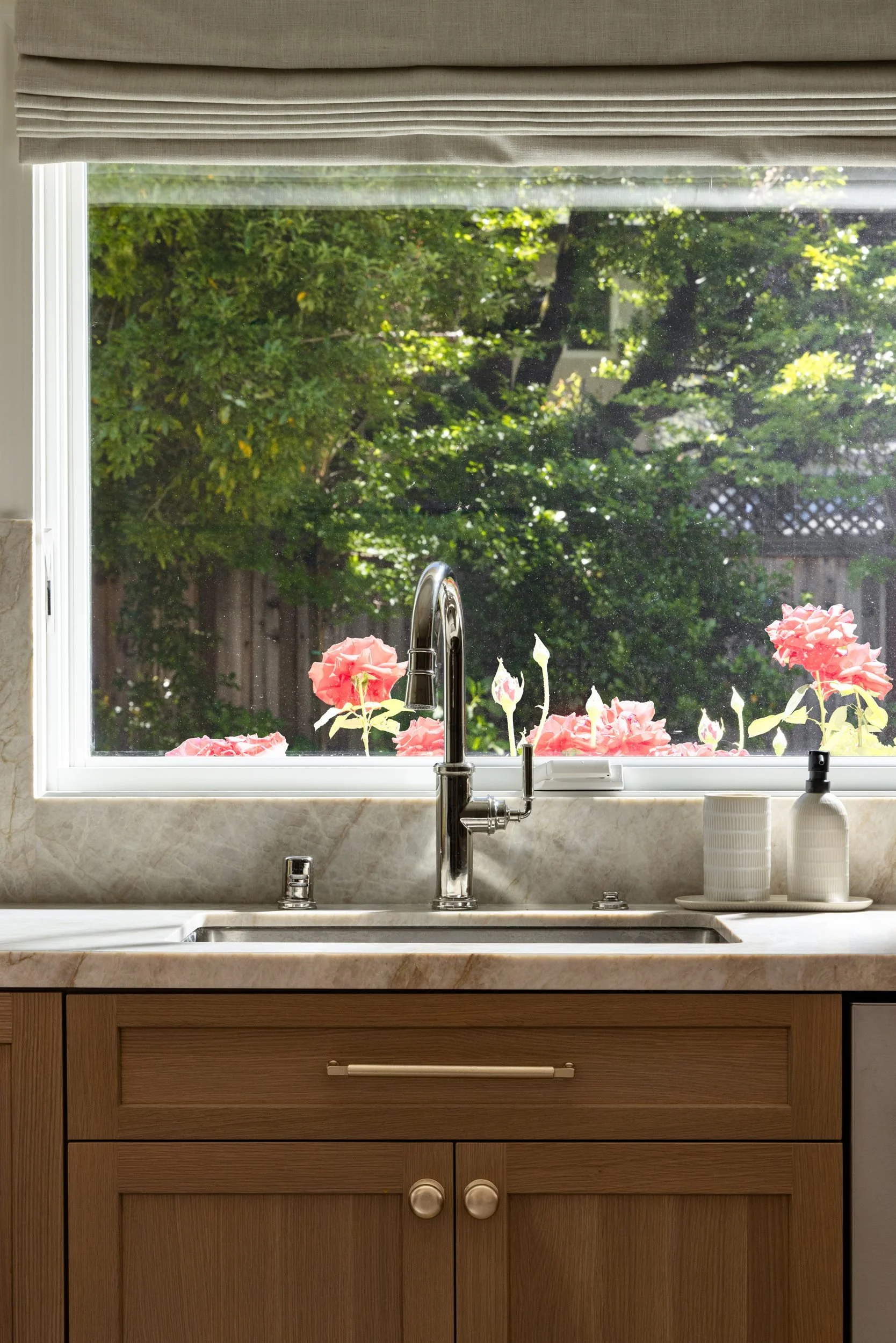 Kitchen sink beneath a garden window with roses, 283 Fairway Drive, Barlow Design