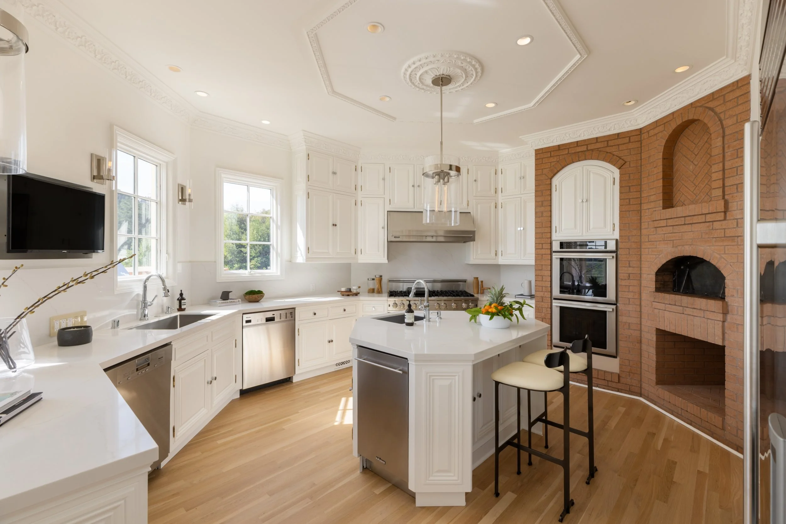 White kitchen with arched windows and center island, 27 Upper Road, Ross