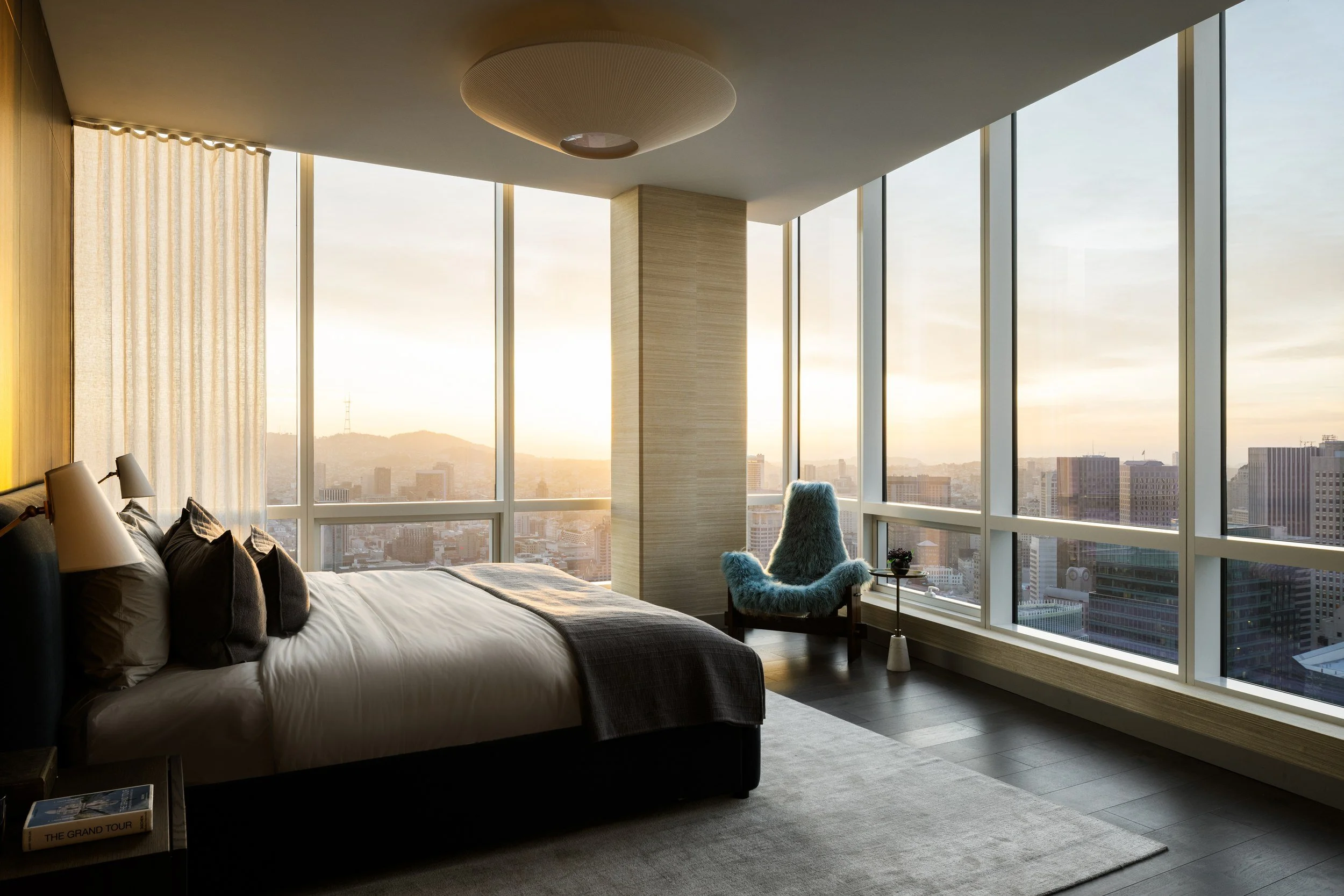 Bedroom at sunset with floor-to-ceiling windows, The Avery, San Francisco