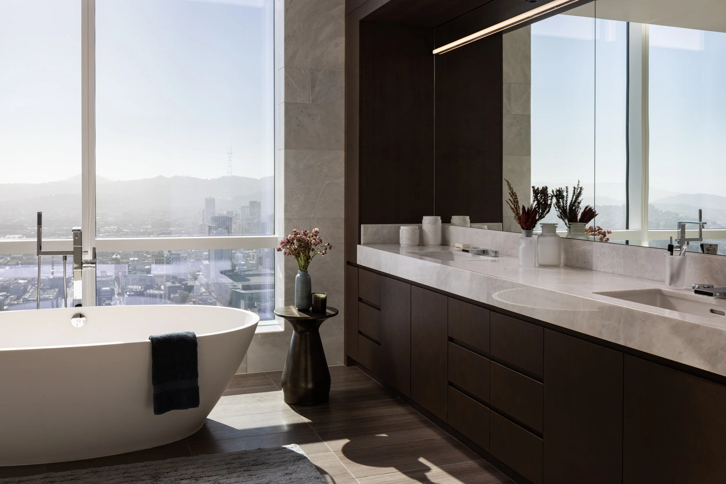 Primary bath with freestanding tub and city view, The Avery, San Francisco