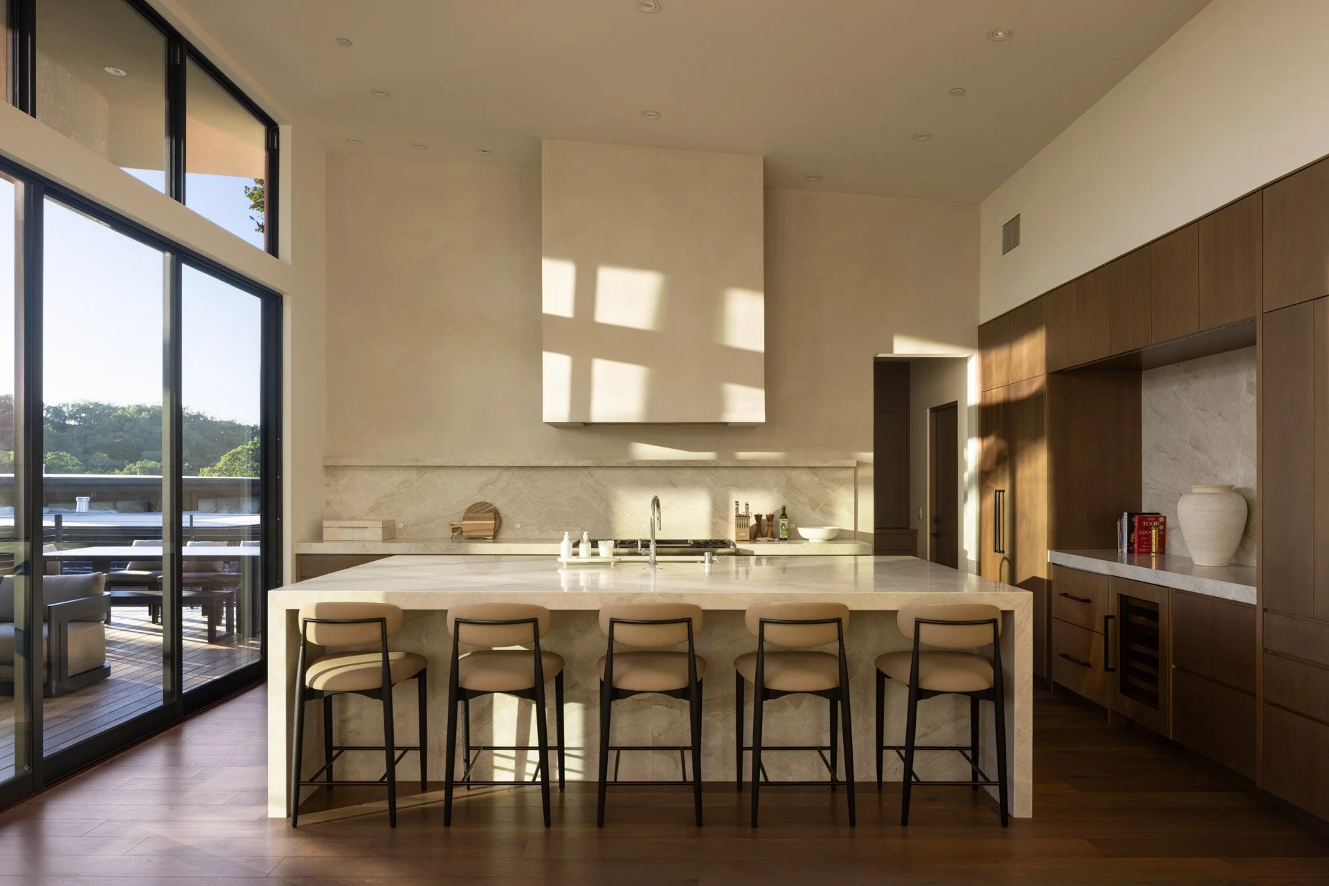 Kitchen island with stone counters and walnut cabinetry, a resort residence at Montage Healdsburg