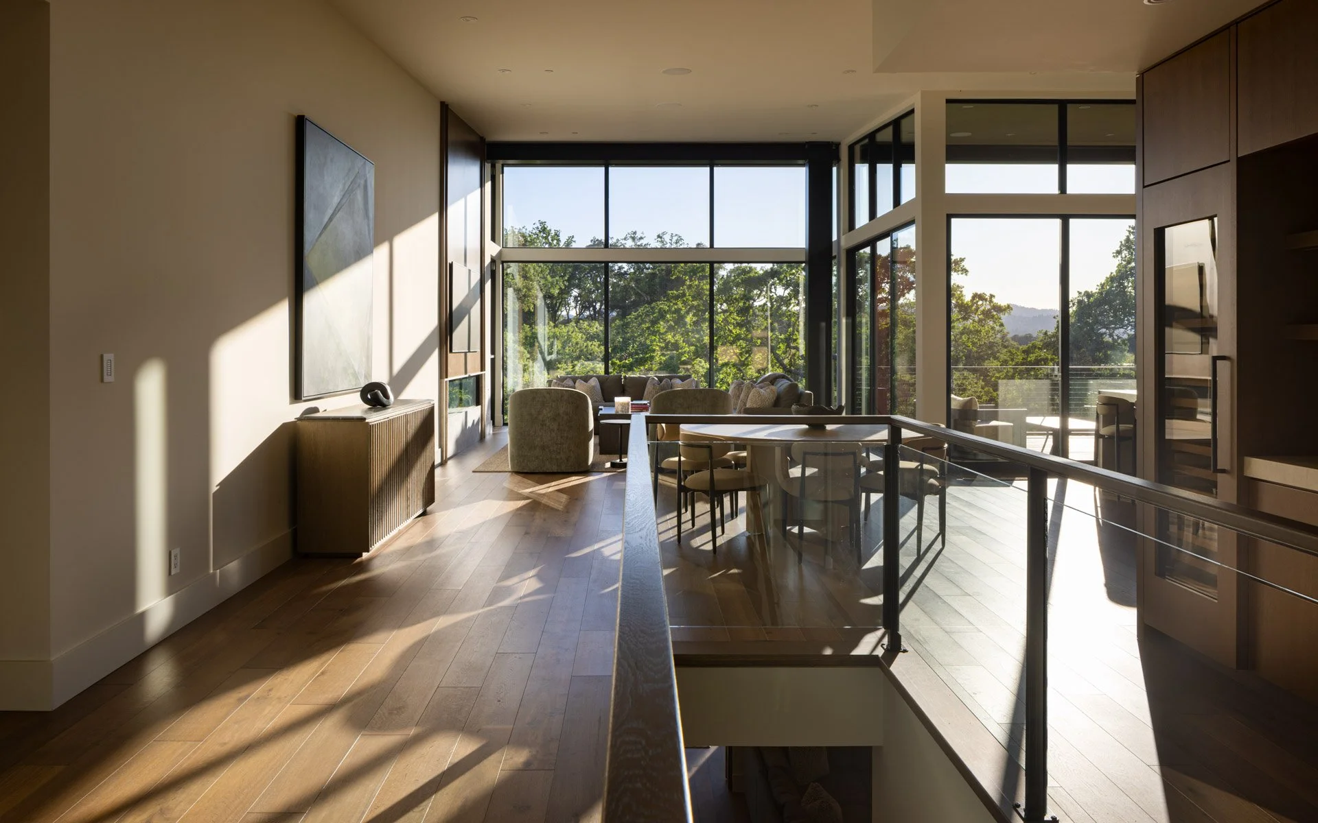 Great room with walls of glass looking into the oak canopy, a resort residence at Montage Healdsburg
