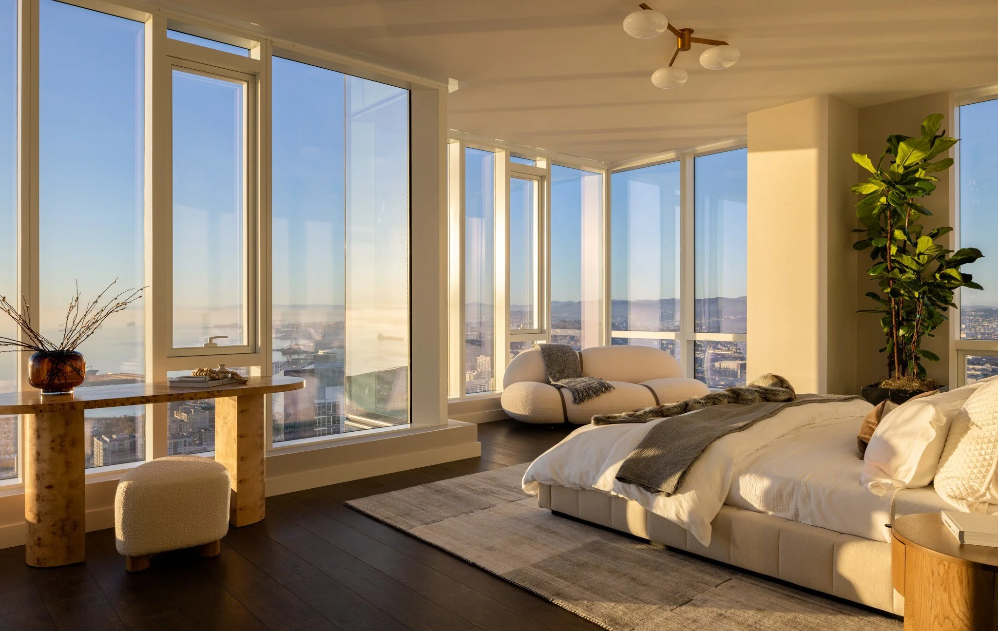 Penthouse primary bedroom with corner windows over the city, The Avery, San Francisco