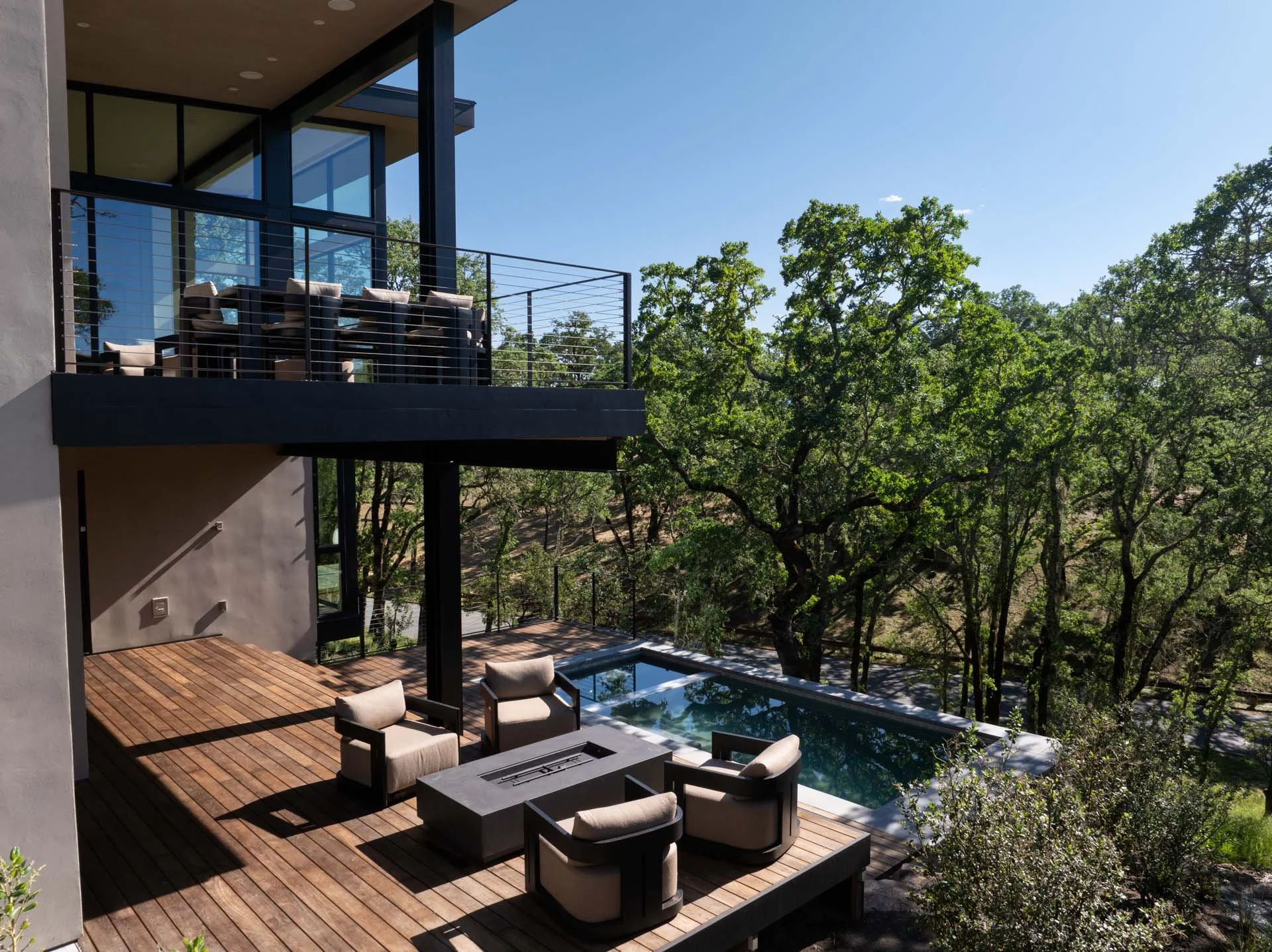 Aerial view of the deck, fire lounge and pool among the oaks, a resort residence at Montage Healdsburg