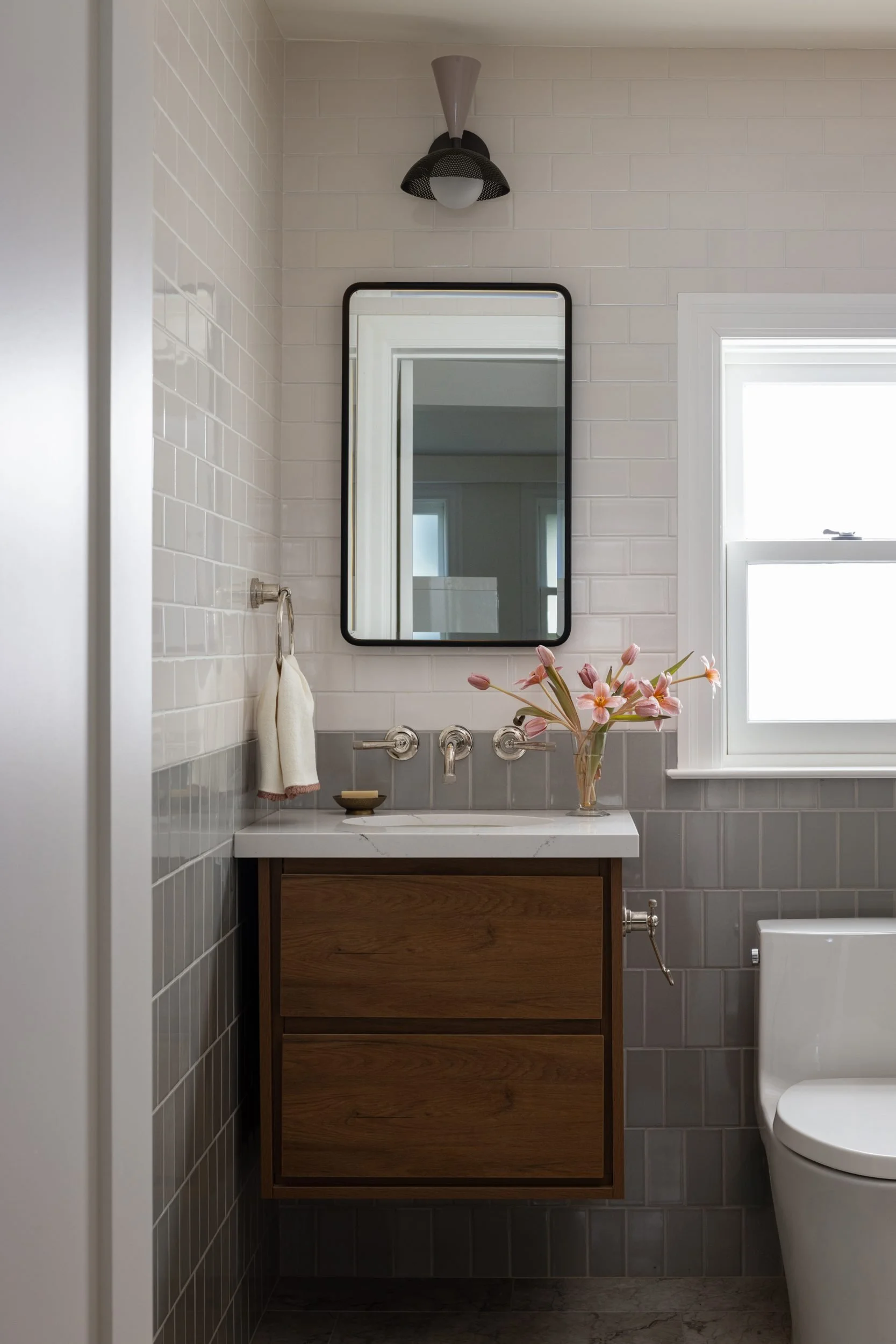 Guest bath with floating walnut vanity and grey stacked tile, 99 Bosworth, Barlow Design