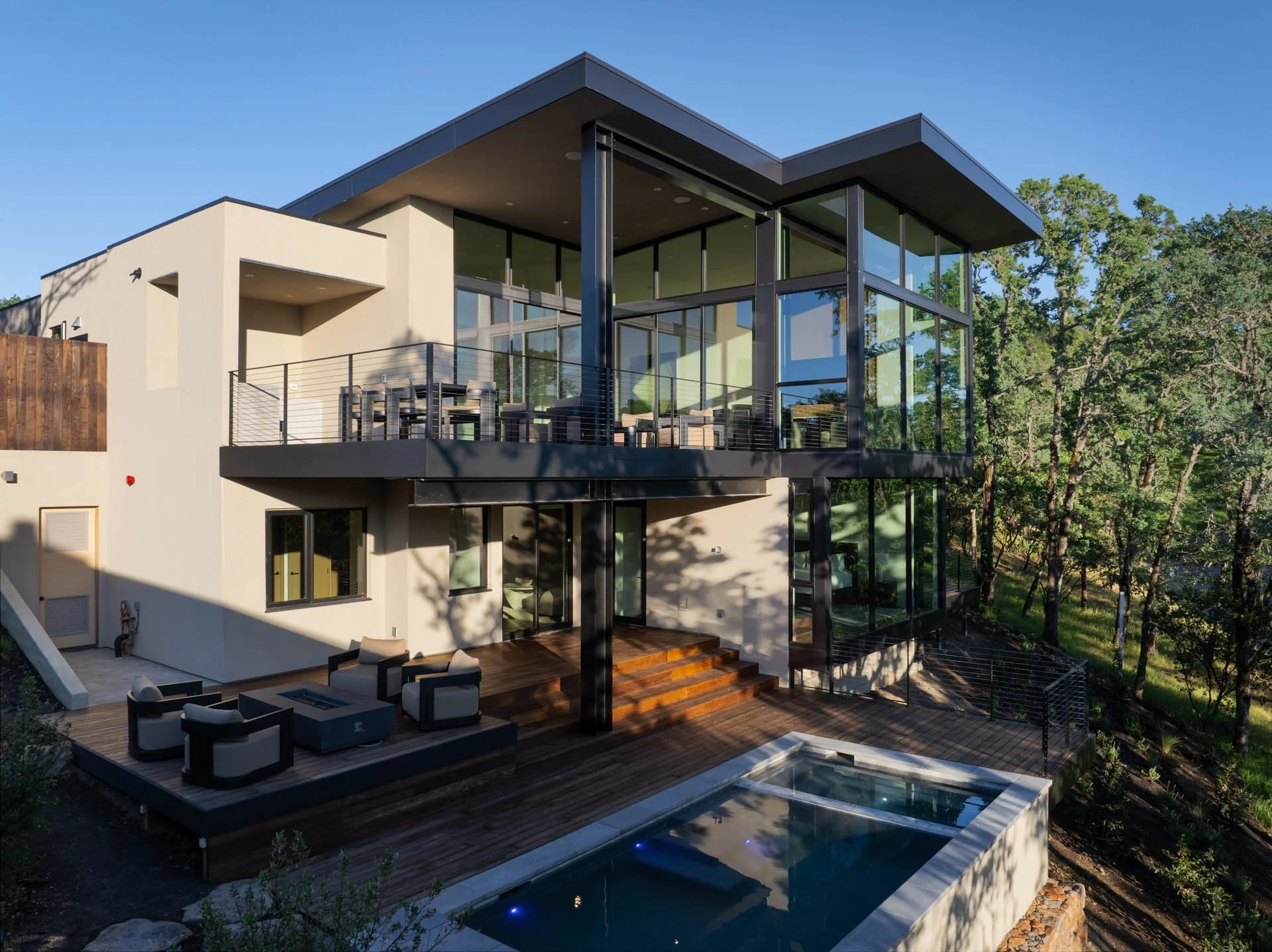 Rear elevation with decks and pool in afternoon light, a resort residence at Montage Healdsburg