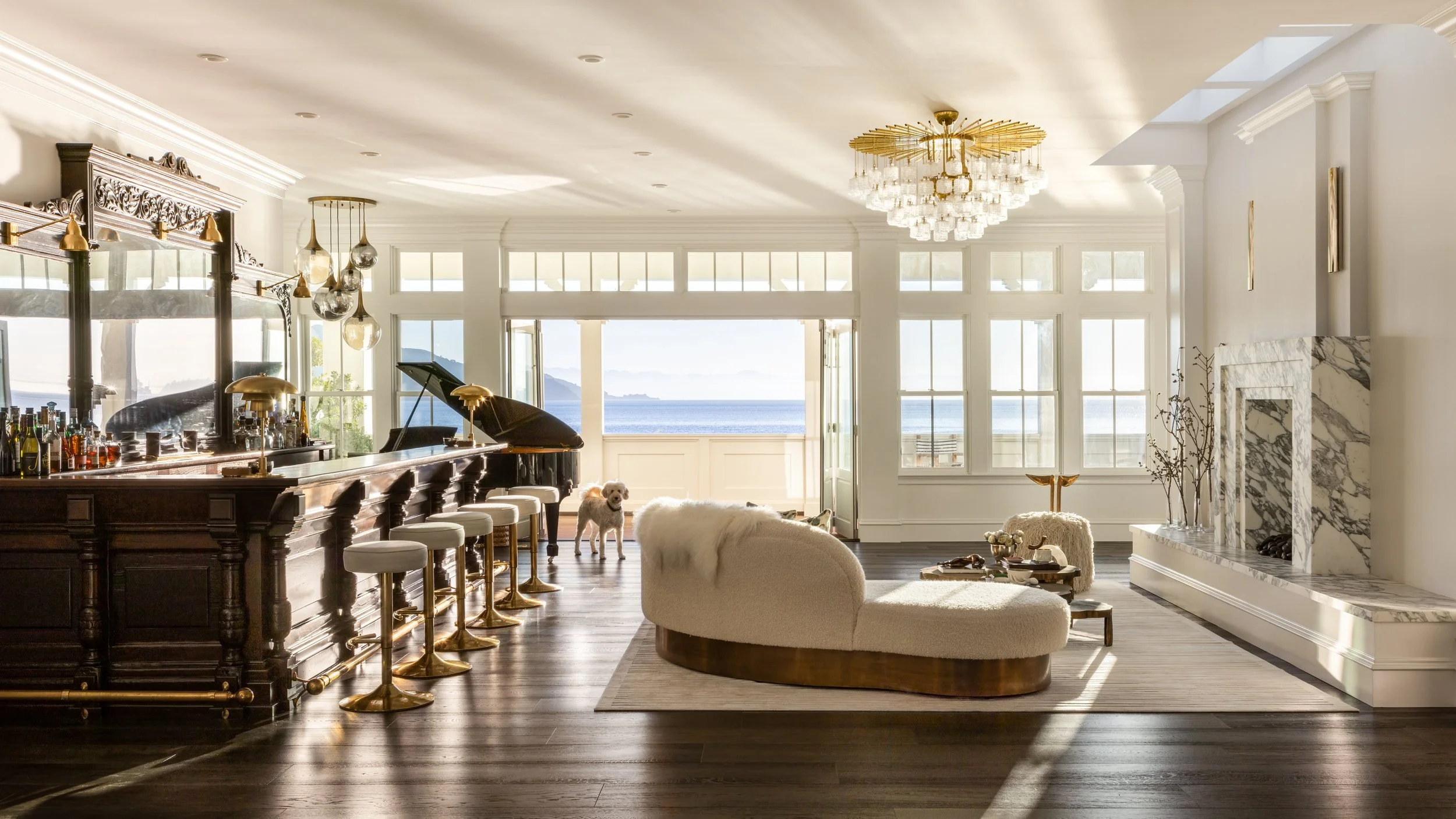 Great room with the restored antique back bar, grand piano, curved sofa and bay views, Valhalla, Sausalito