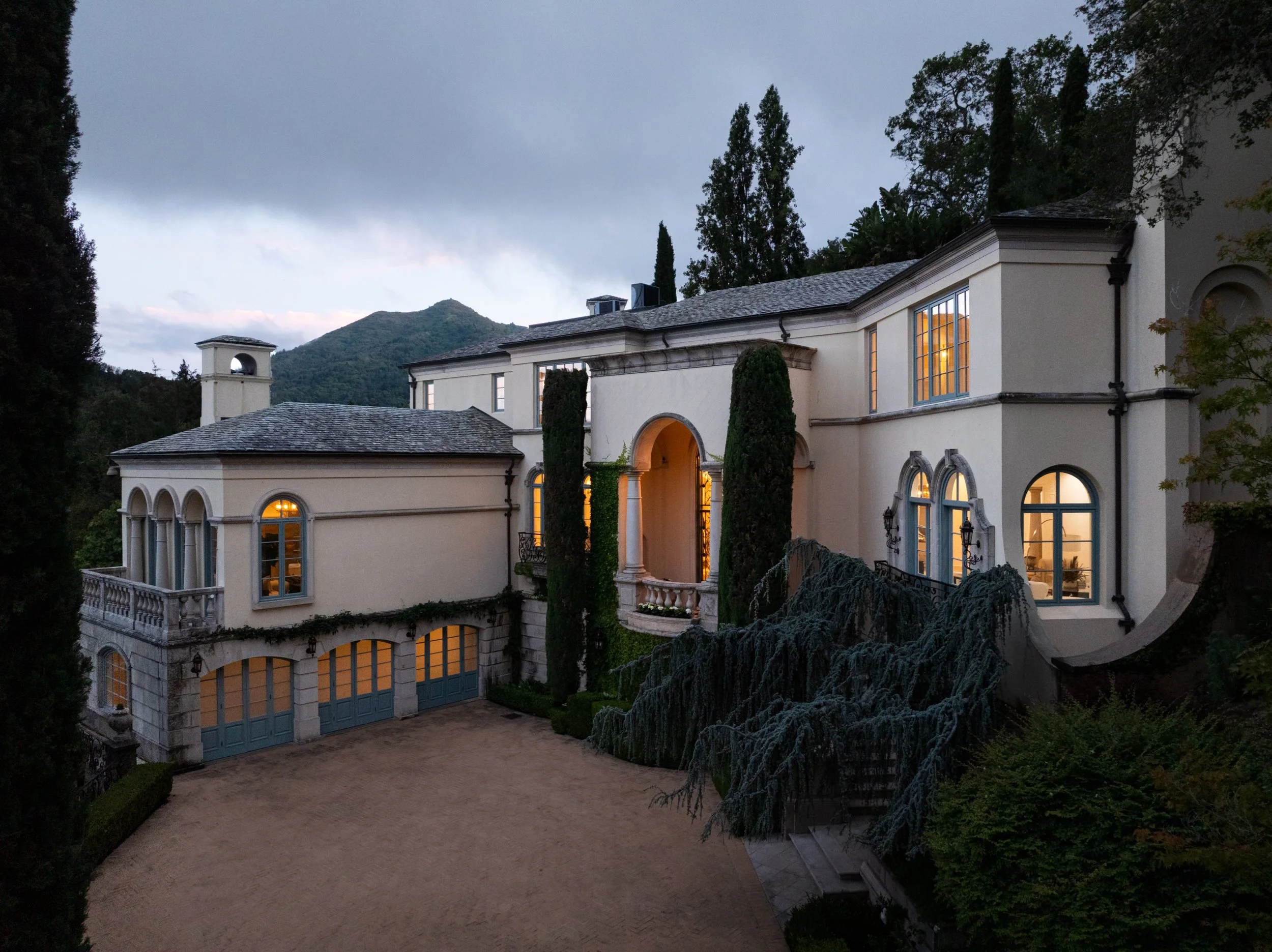 Entry courtyard and stone facade of a Mediterranean estate, 27 Upper Road, Ross