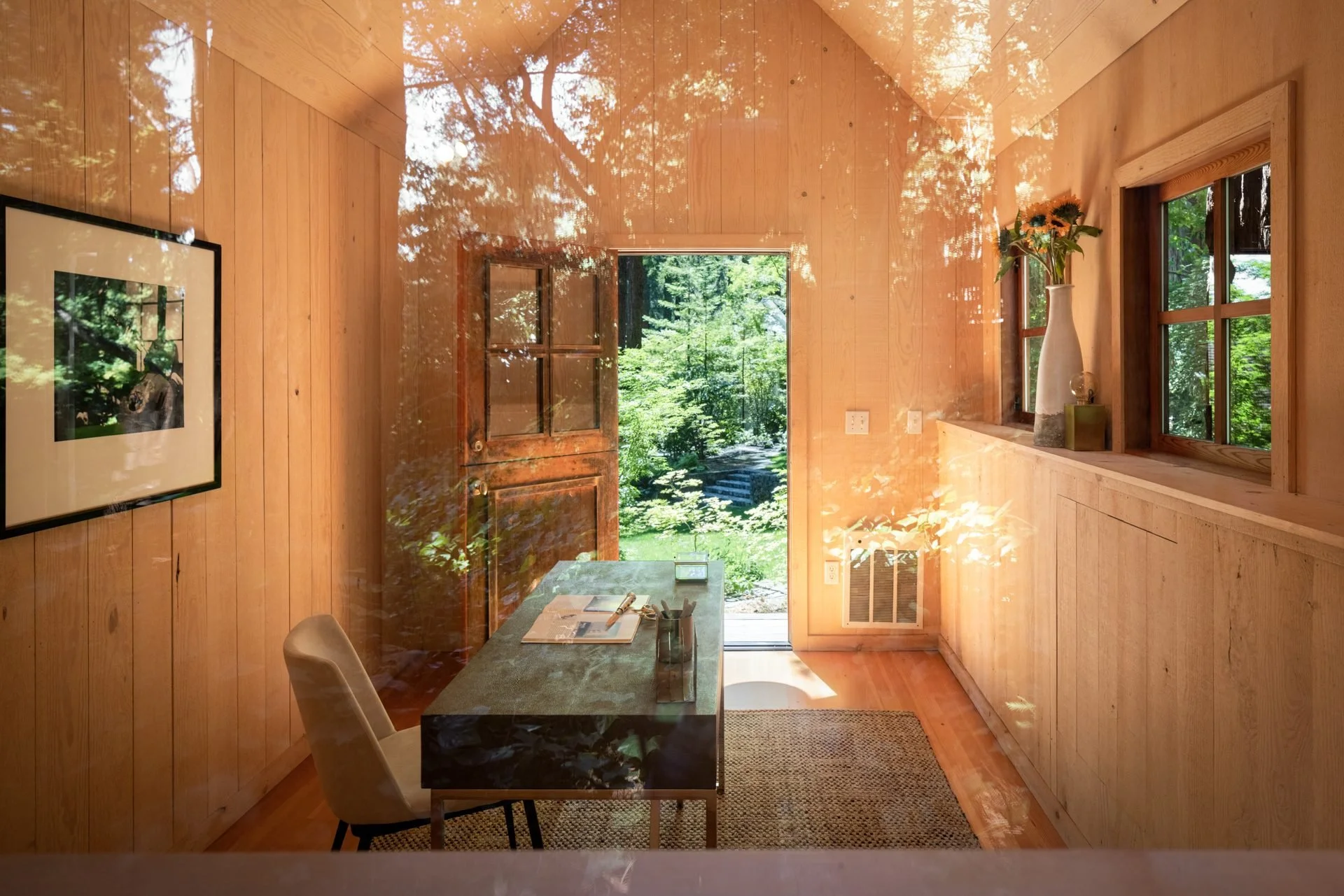 Wood-lined study with a writing desk and doors opening to the garden, 16 Woodside, Mill Valley