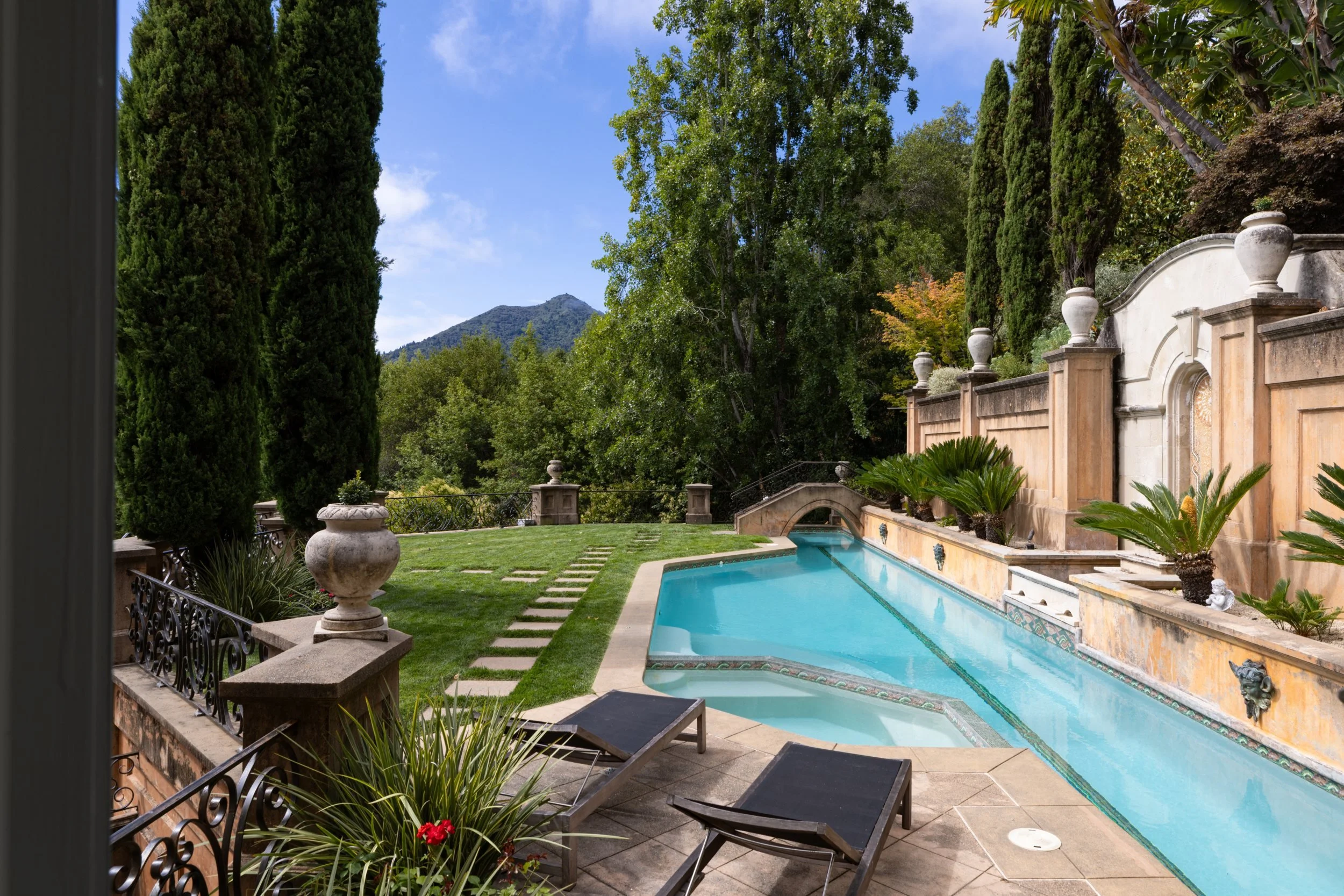 Swimming pool framed by Italian cypress, 27 Upper Road, Ross