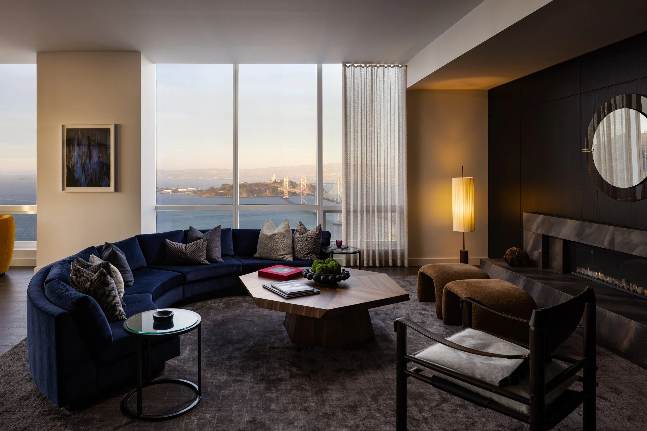 Residence living room at dusk with city and Bay views, The Avery, San Francisco