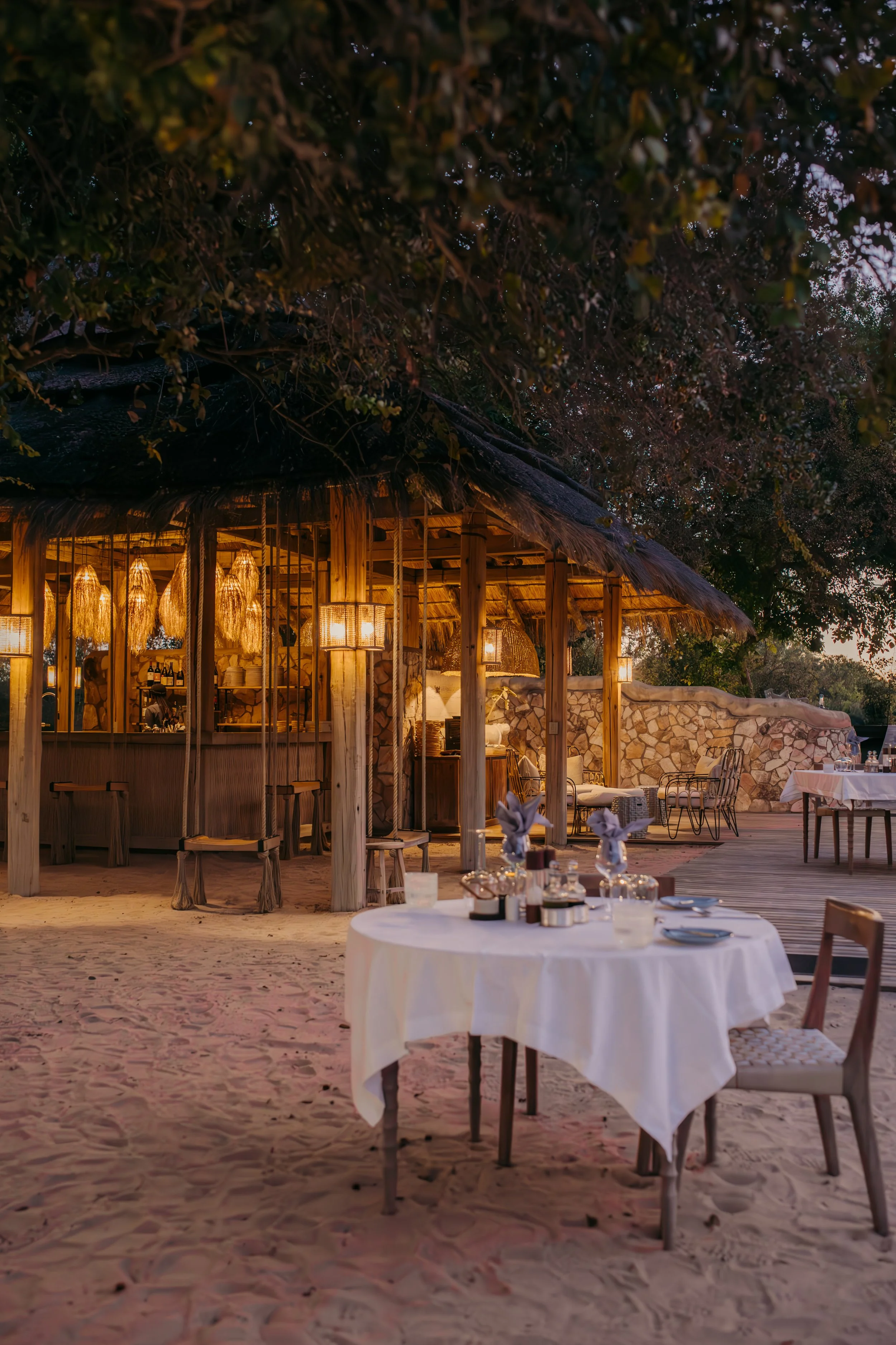 Mpala Jena Zimbabwe Victoria Falls luxury safari property lodge dining area food aesthetic beautiful beach and bush