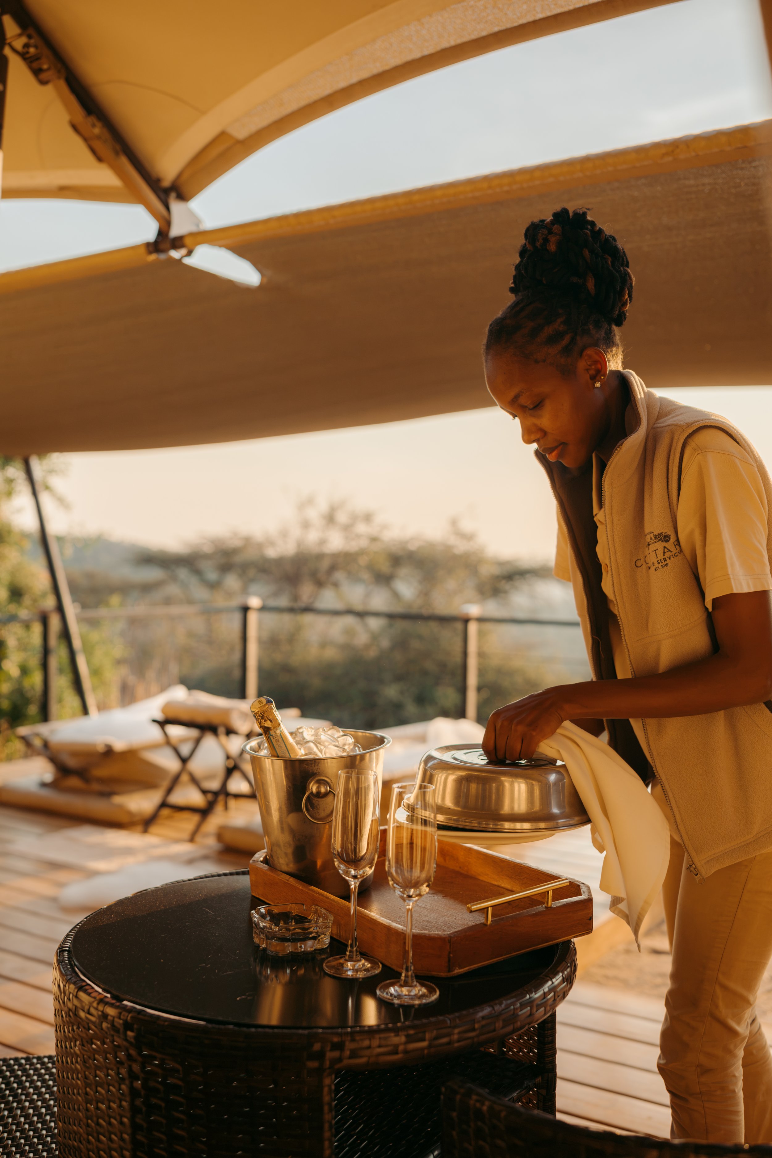 Cottar's 1920s Camp safari Kenya Maasai Mara staff candid bush bath canvas setup room romantic detail drinks champagne sunset 