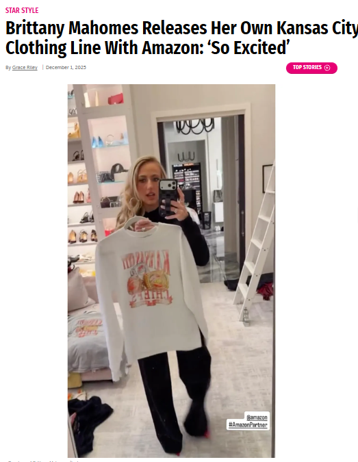 Brittany Mahomes takes a mirror selfie while holding a white Kansas City-themed sweatshirt in a clothing boutique.