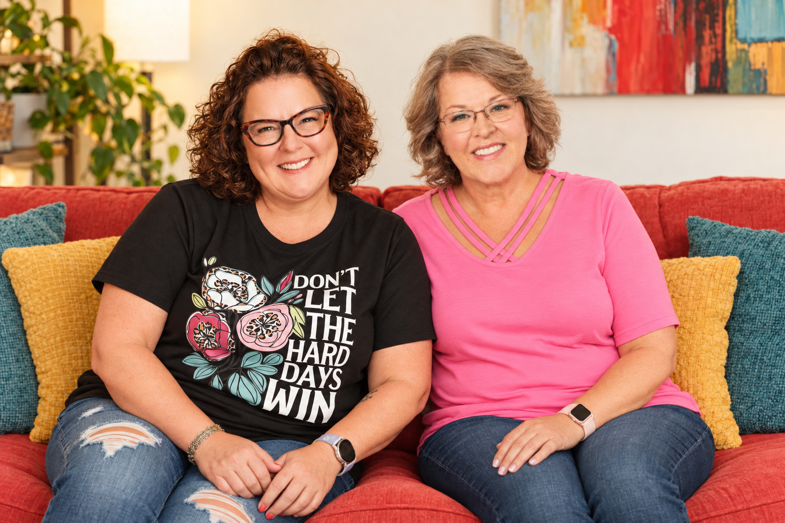 Photo of Melanie Taylor, LPC-S and Dr. Tessa Hastings both sitting on red couch