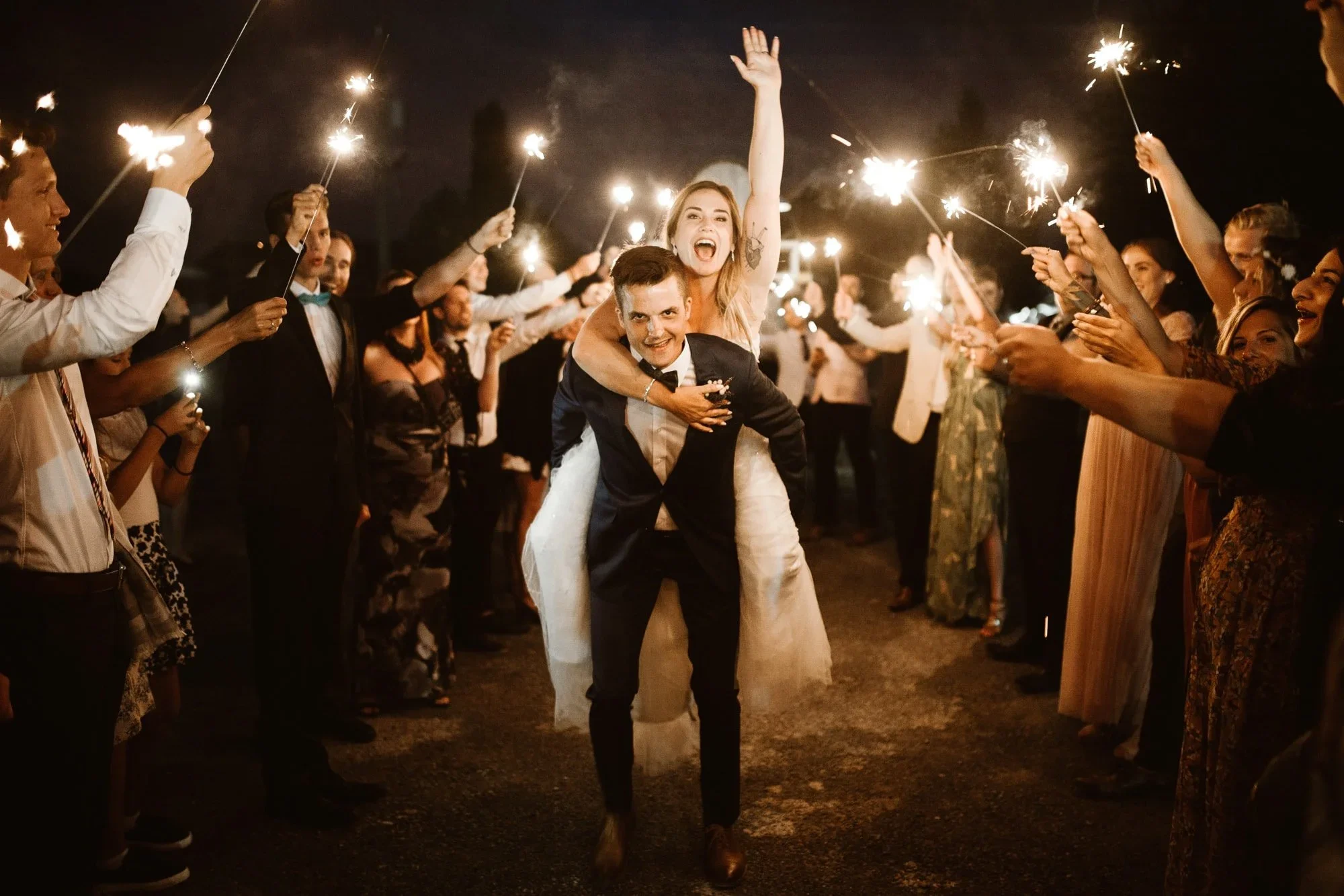 wedding day sparkler send off bride cheering