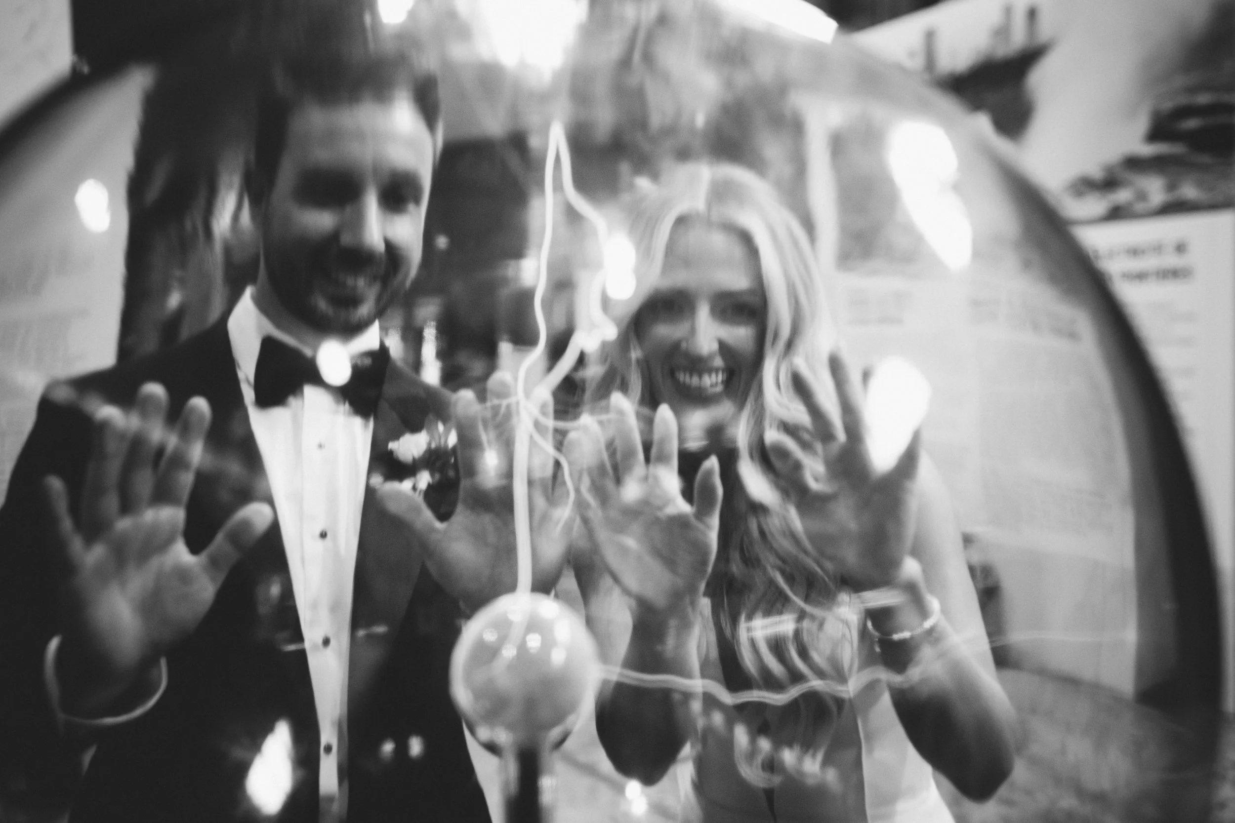 black and white couple touching an electric Tesla ball in Niagara Falls 