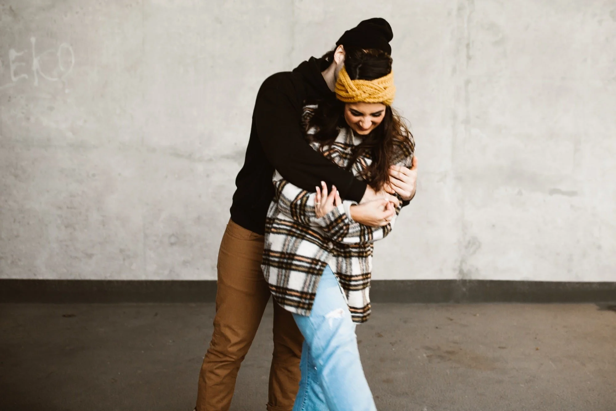 couple hugging in urban environment