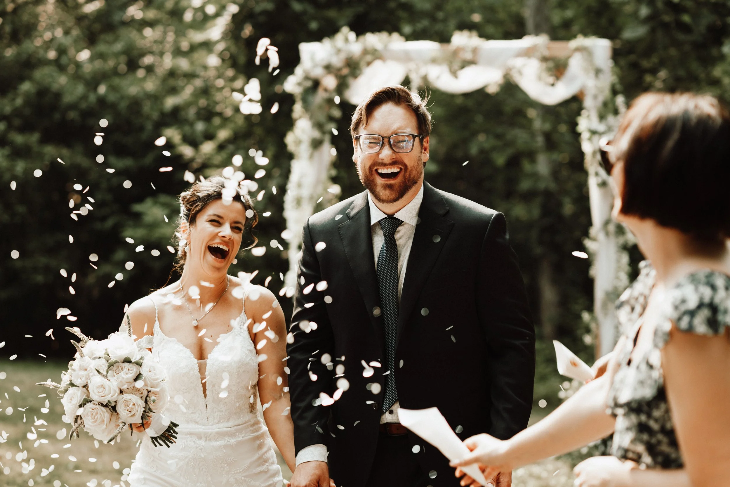 just married bride and groom bathed in confetti