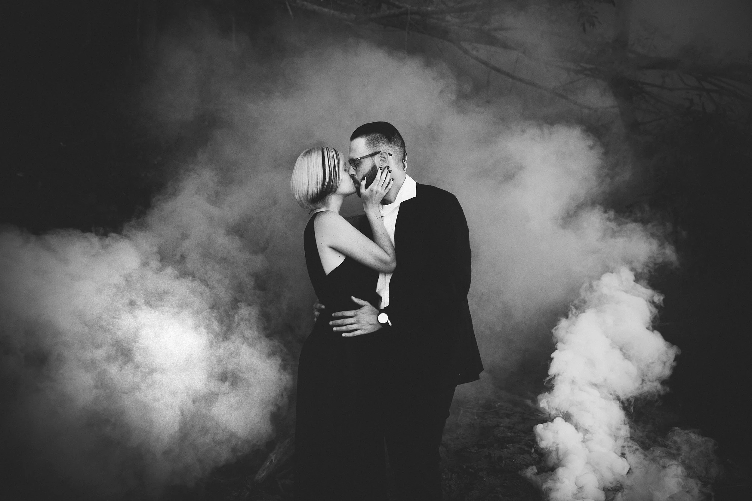 stunning black and white smoke bomb kiss image 