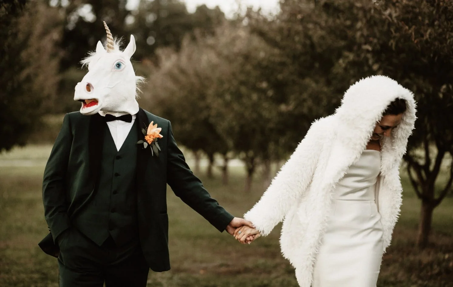 bride and groom portrait with groom wearing unicorn mak
