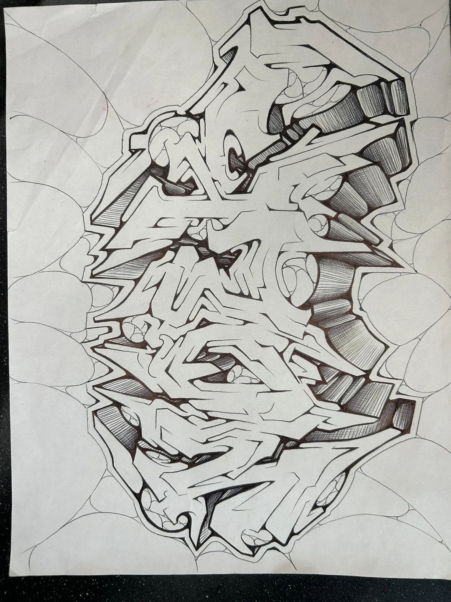 Hand-drawn black-and-white abstract graffiti-style lettering with sharp angular shapes and crosshatched shading
