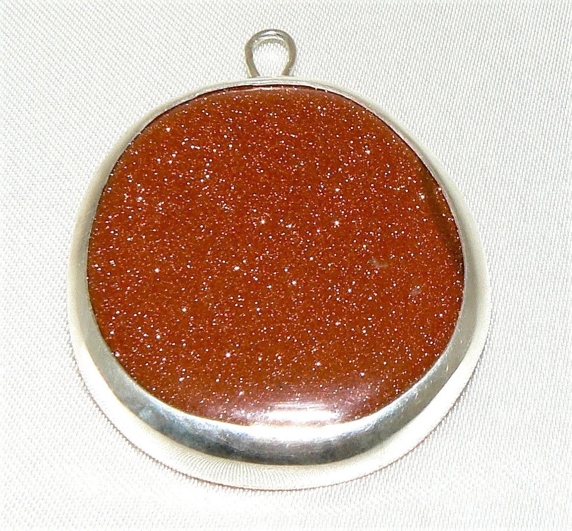 Goldstone pendant, silver bezel on copper back plate, 45mm, reversable 