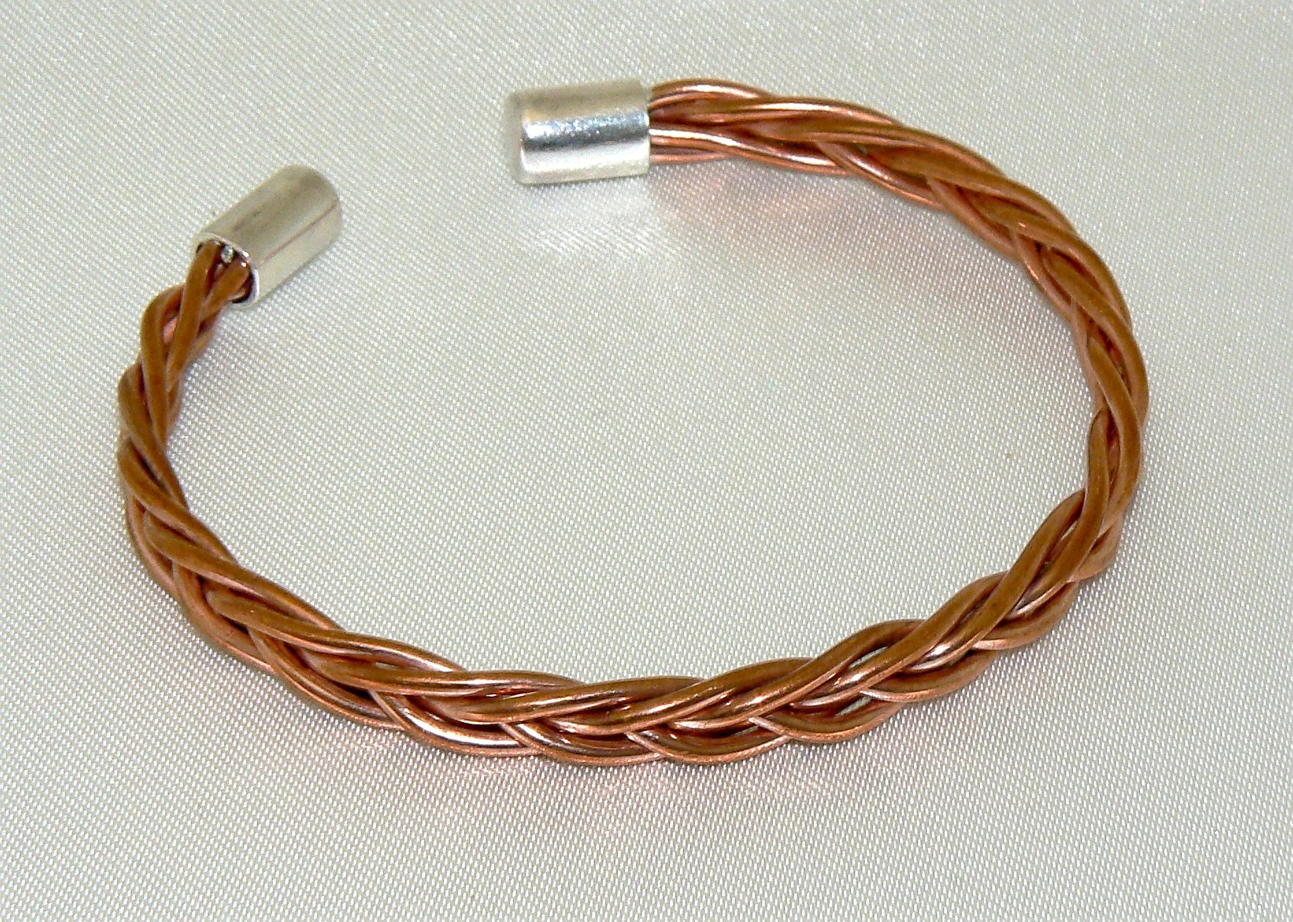 3 way plated copper cuff with sterling silver cylinder ends, 70mm diameter, but can me adjusted to suit.