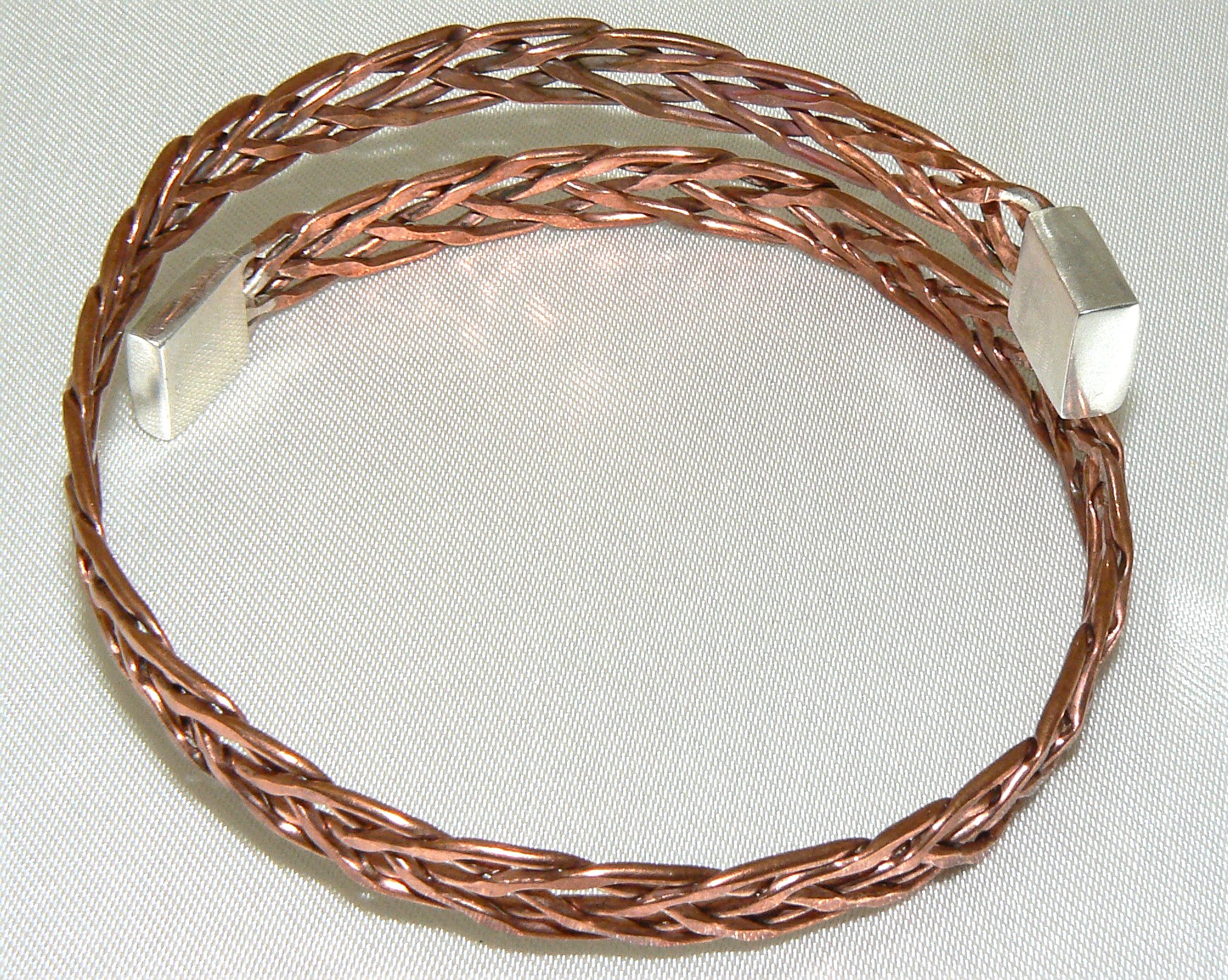 Five-way plaited copper wrap-around cuff with silver end caps