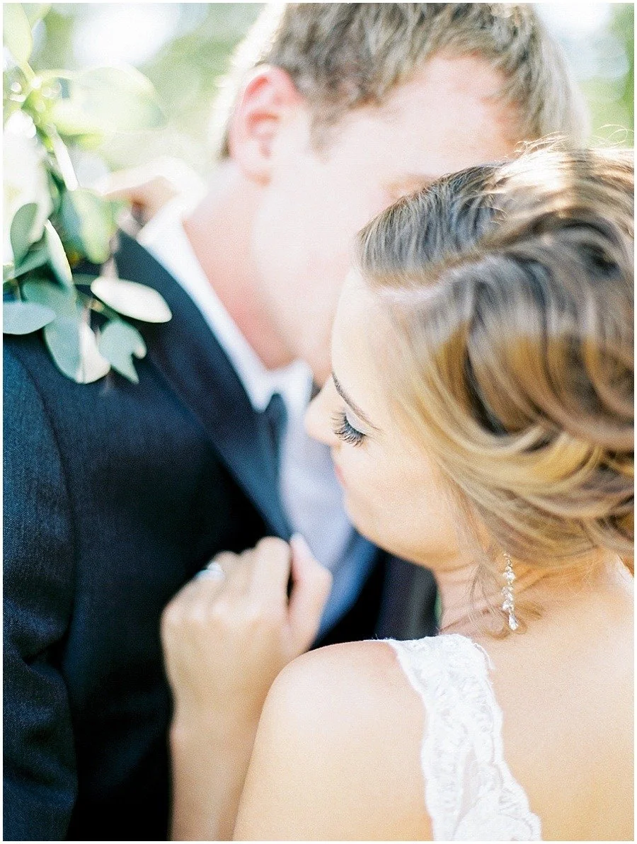 A close portrait shows the couple’s faces and the bride’s hand on the groom’s lapel.