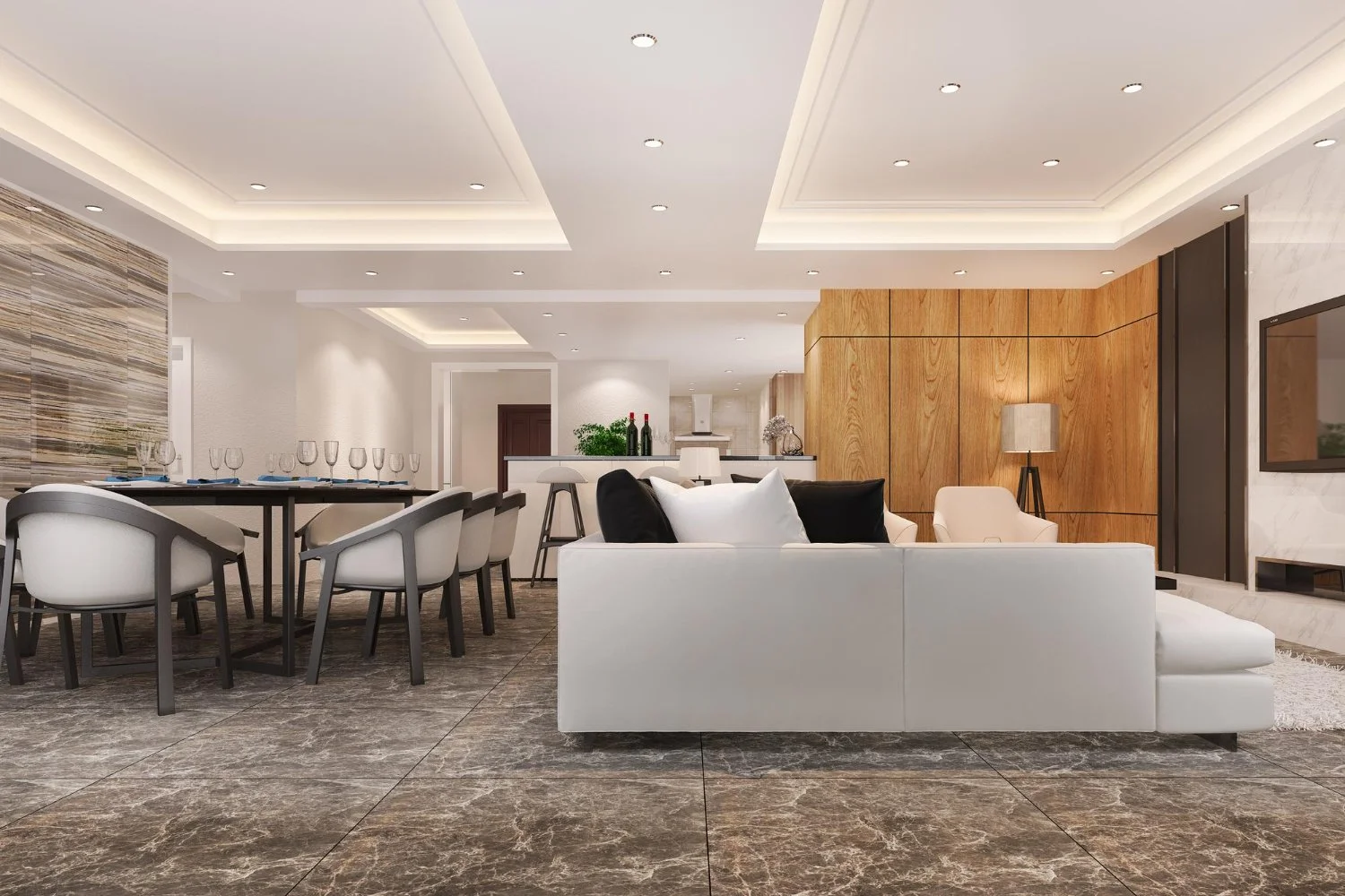 Modern luxury open-plan living and dining room with white sectional sofa, wood-paneled wall, fireplace, dining table, and recessed lighting