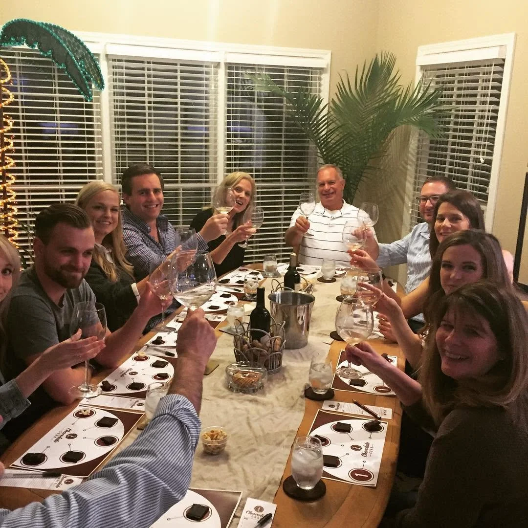 Guests gathered at a Chocolate Cork chocolate and wine pairing party.