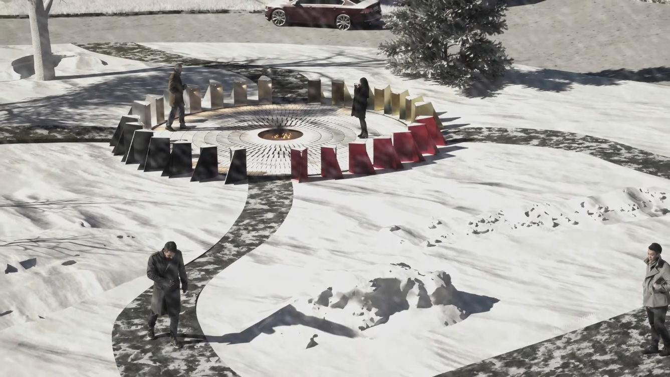 Snow-covered circular memorial with a central fire, colored metal panels, and four people standing nearby.