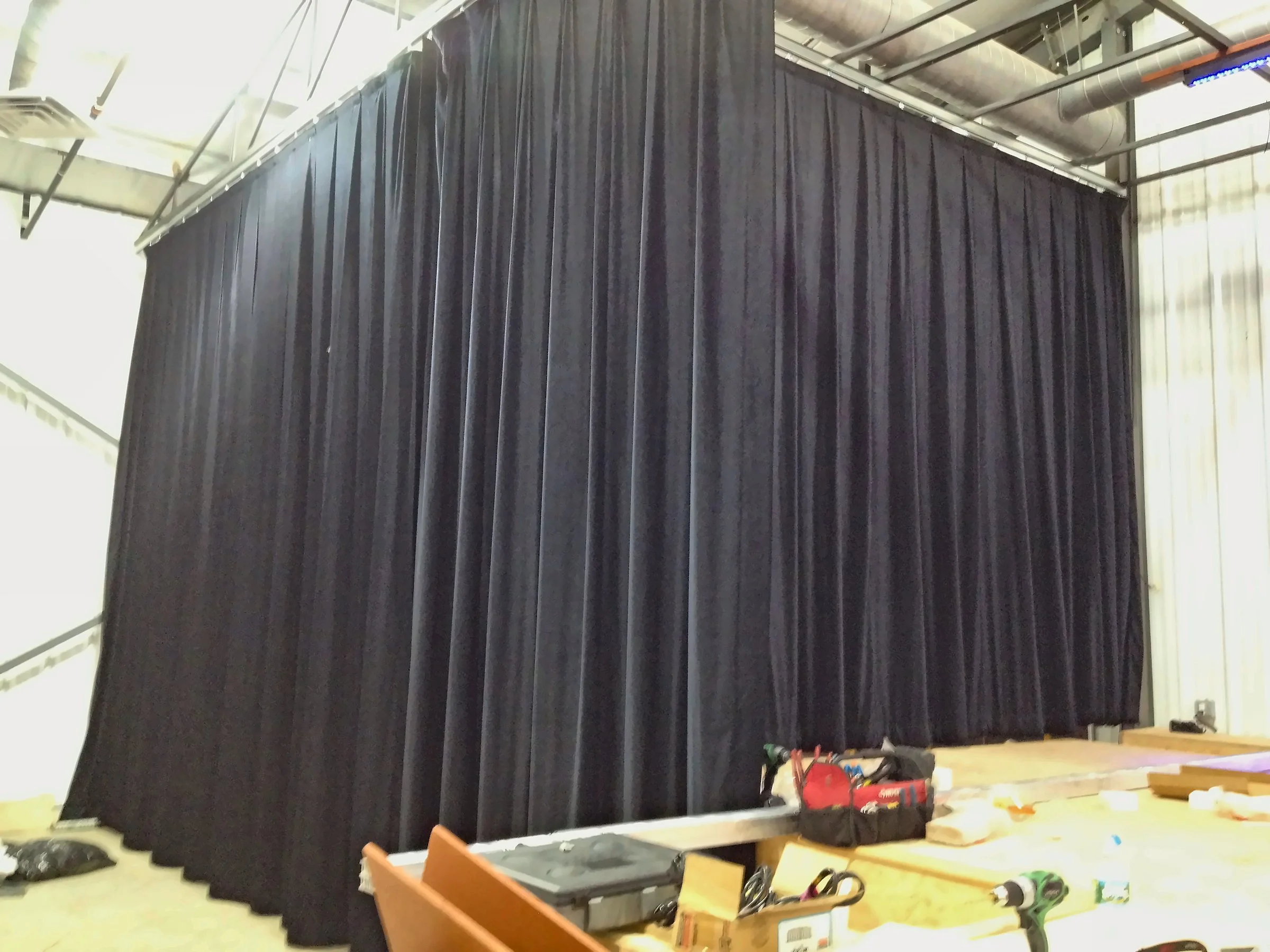 Hanging the black stage curtains