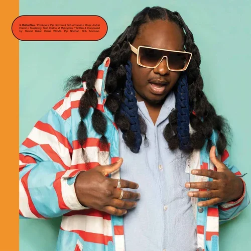 Portrait of a musician with long braids and white sunglasses wearing a red, white, and blue striped jacket against a turquoise background