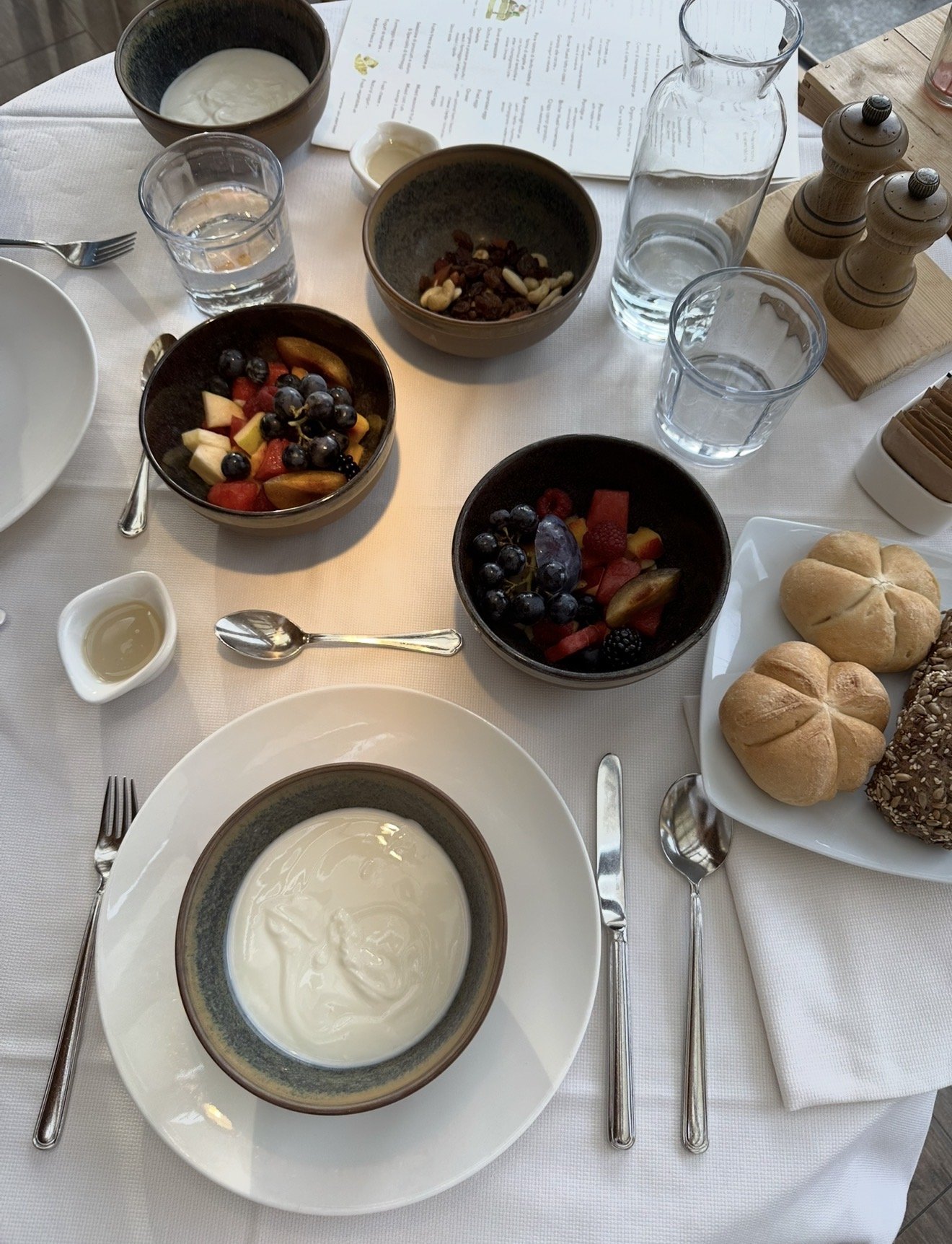 Breakfast at My Arbor: yoghurt, fresh fruit, nuts and bread rolls